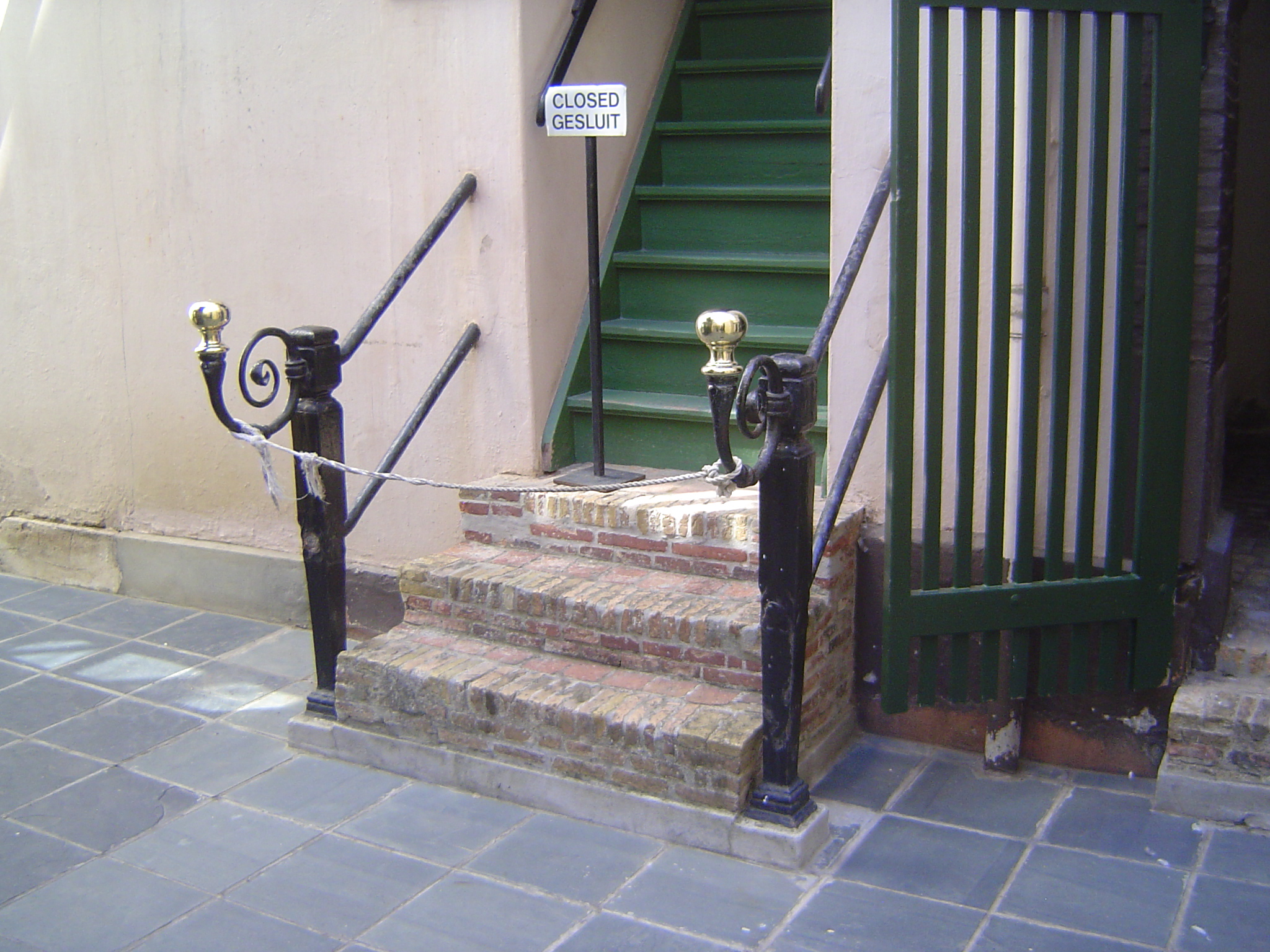 Slave-quarters were upstairs in the back and over a stable. Presumably one of their tasks was polishing these hitching posts.