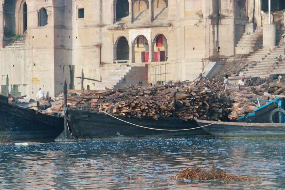 Boatloads of firewood heading to the cremation ghats.