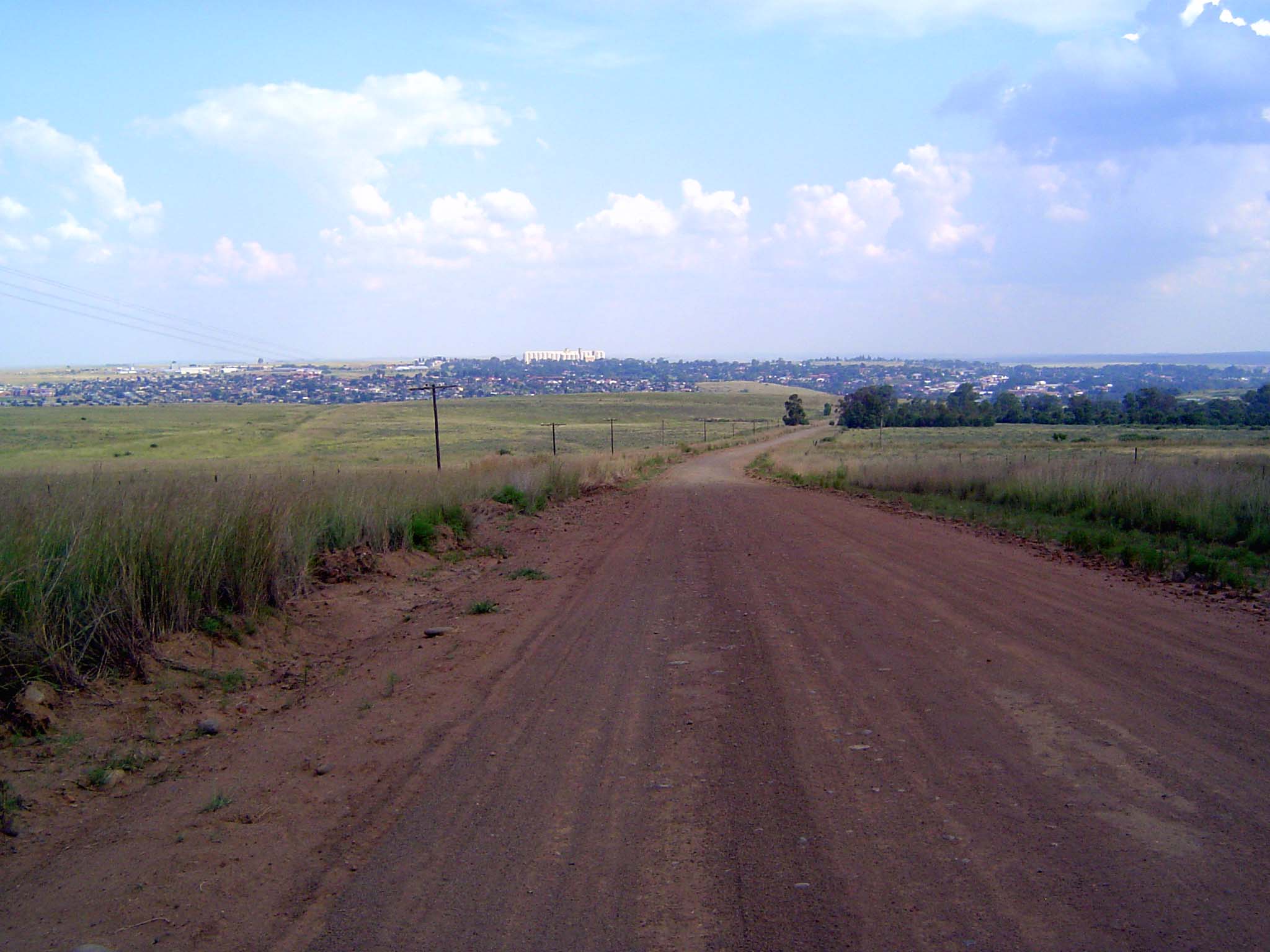 The road drops toward Frankfort, a huge grain elevator in the distance.