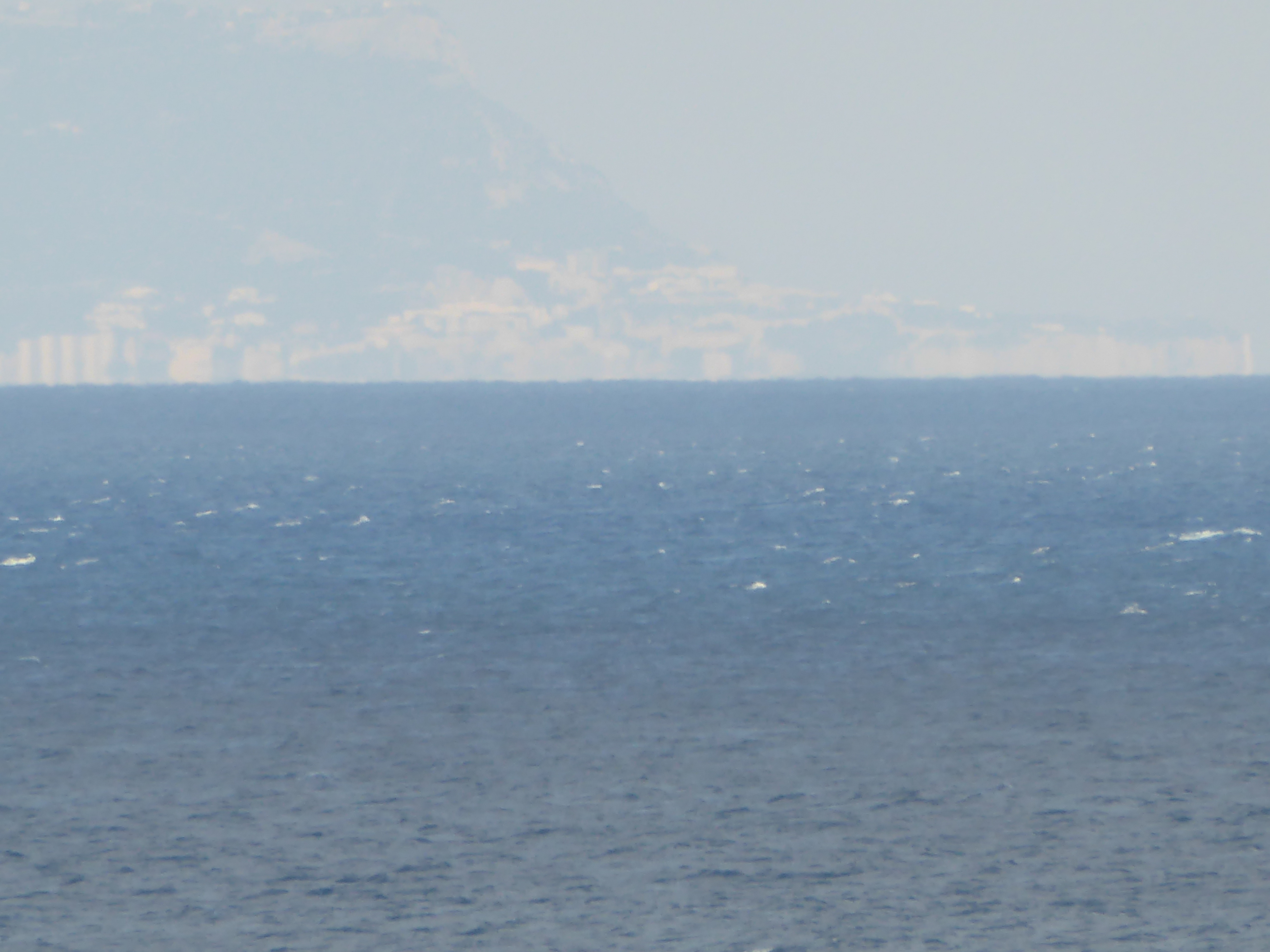 And here, zoomed from the spot, is Spain, some 20 miles away.