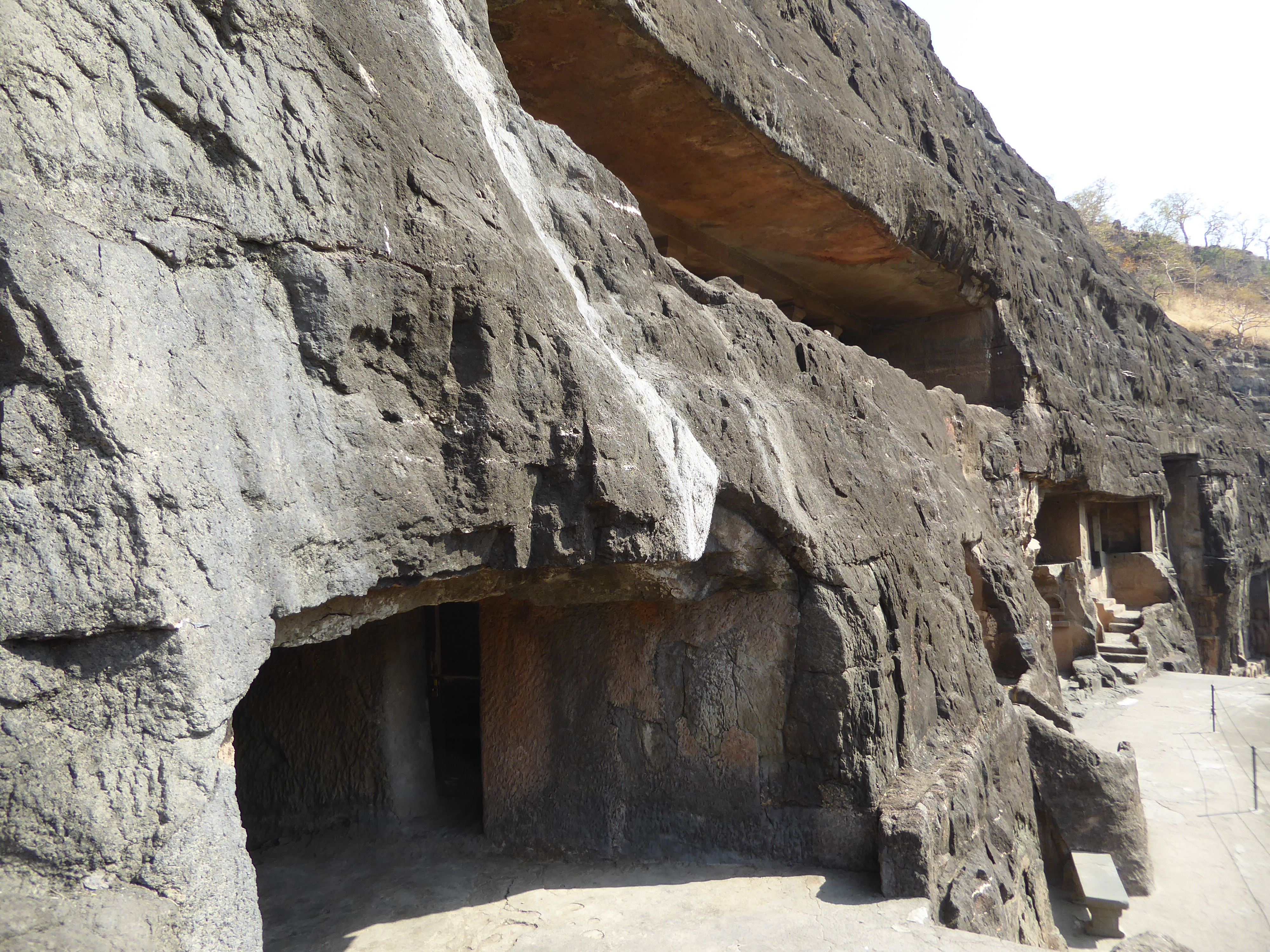 We'll take a look now at the viharas, starting with these unfinished ones between 20 and 21. The general pattern was to dig a tunnel, then c