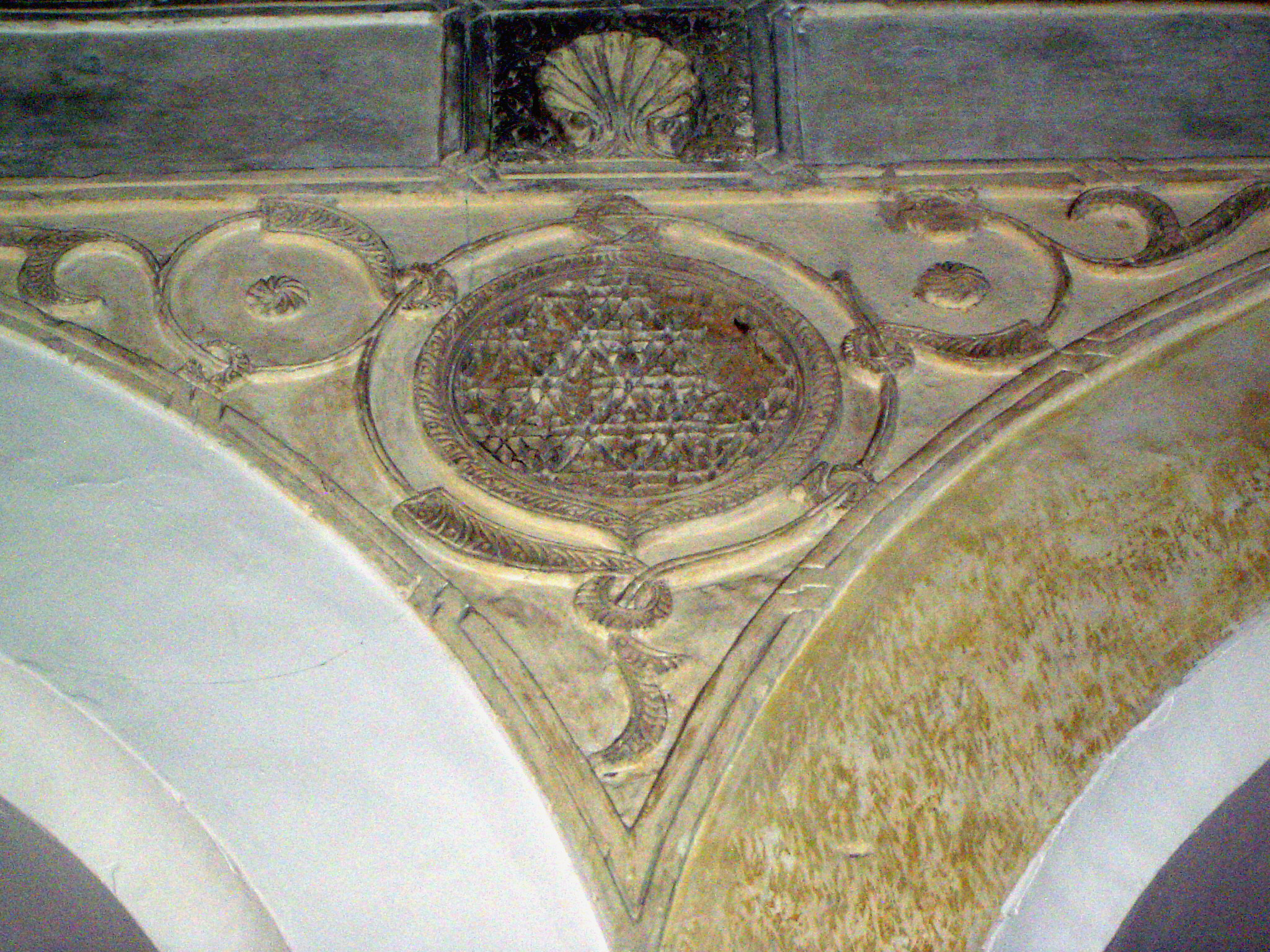 A Star of David is subtly hidden in one spandrel.