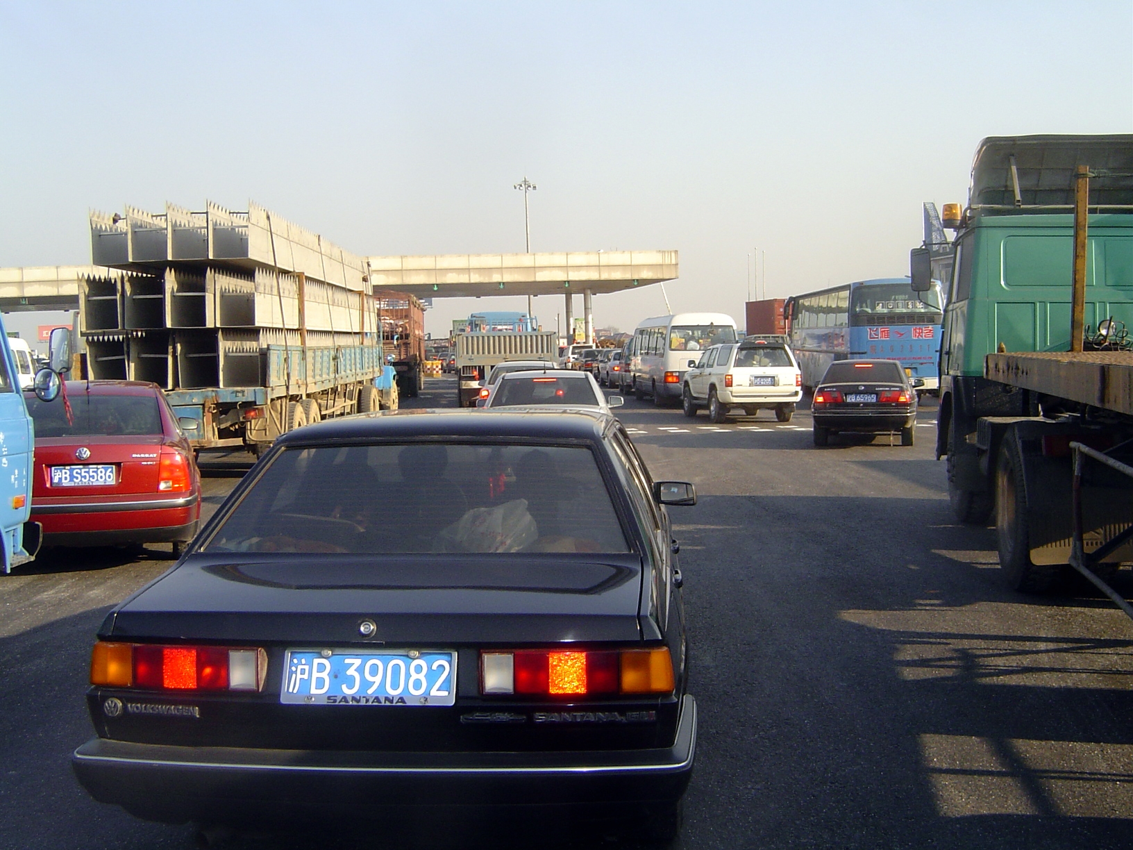 Down the road a bit, a toll plaza. You have to pity the tourist who goes to China in search of storybook exoticism.