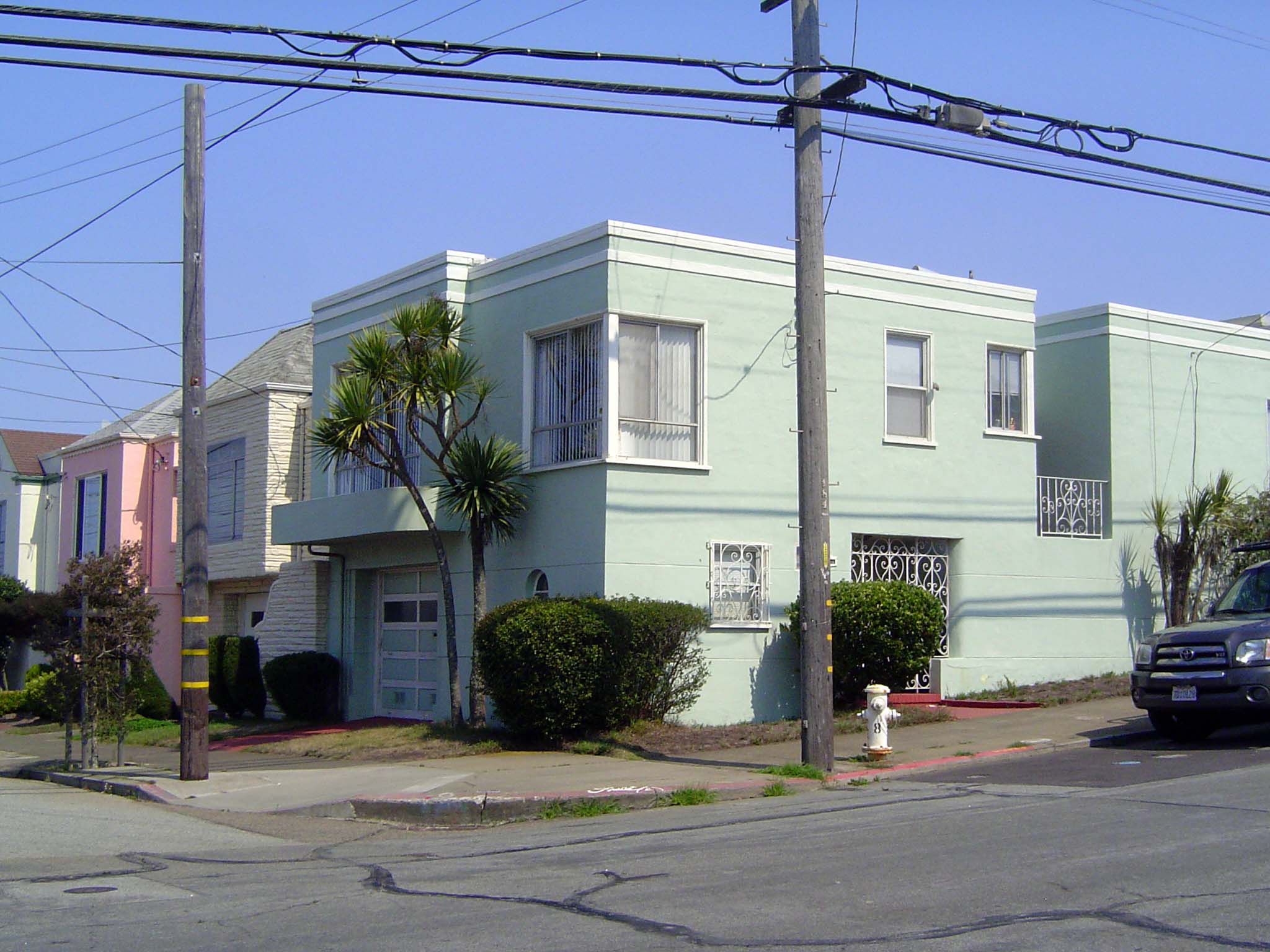 Styles ran from pseudo-Spanish to budget Moderne. Underneath, the framing was redwood.