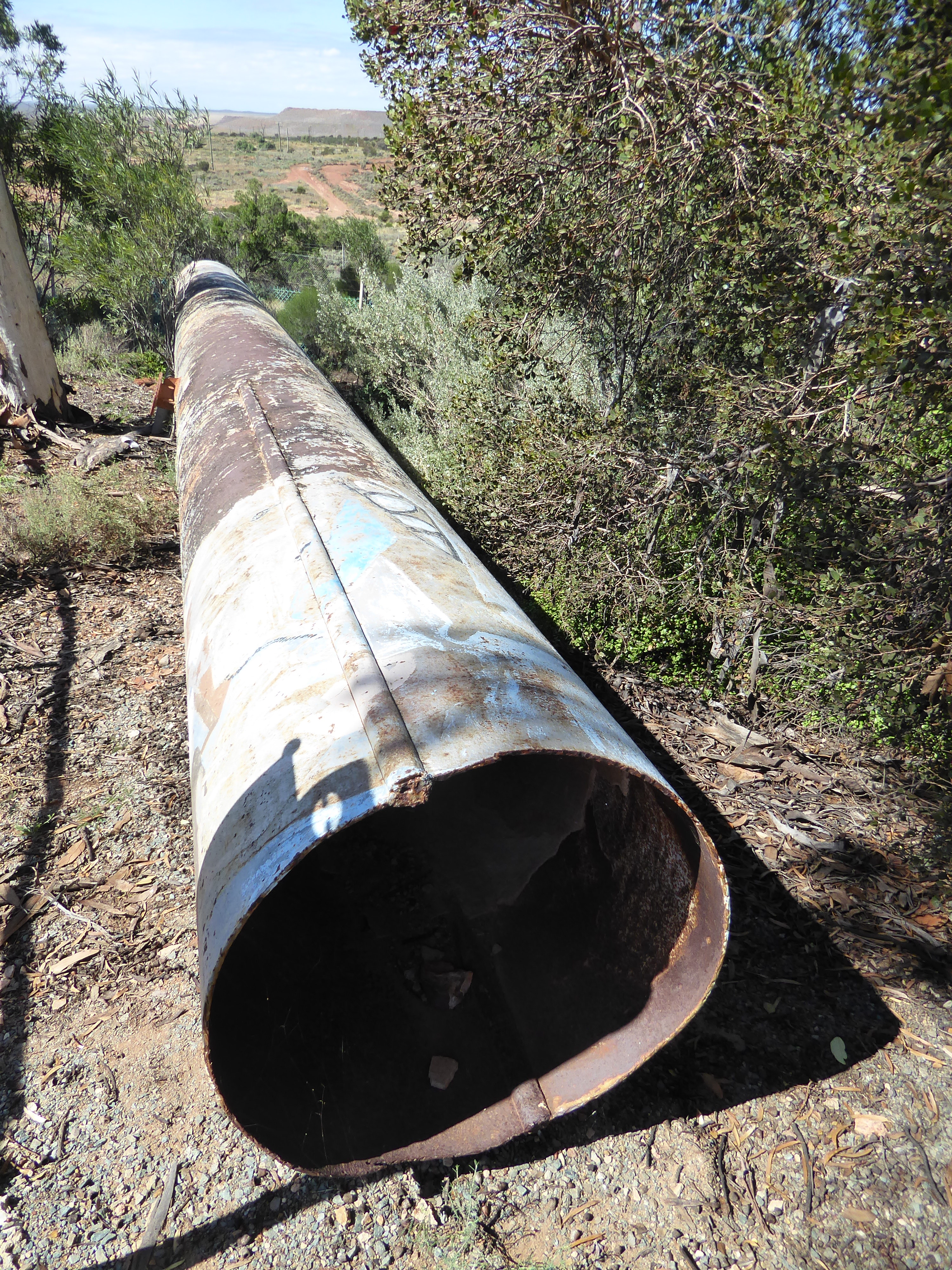 Here's a bit of the original pipe, replaced but saved. It doesn't look like modern pipe; instead, it's two flat sheets were bent into half-c