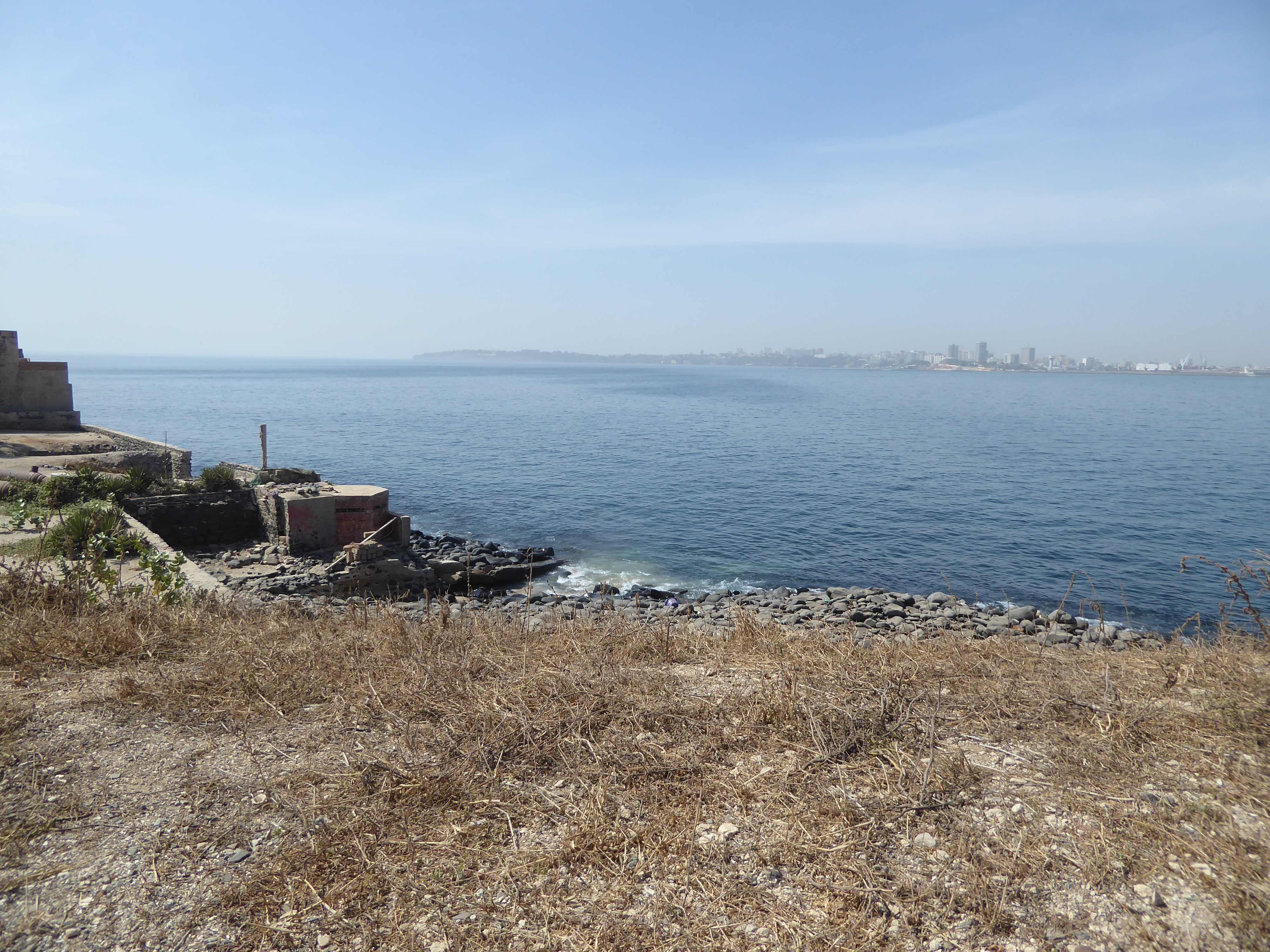 View from the fort toward Dakar. Cape Manuel, the southern tip of the Cape Verde Peninsula hook, is at the end of the land mass there. Head