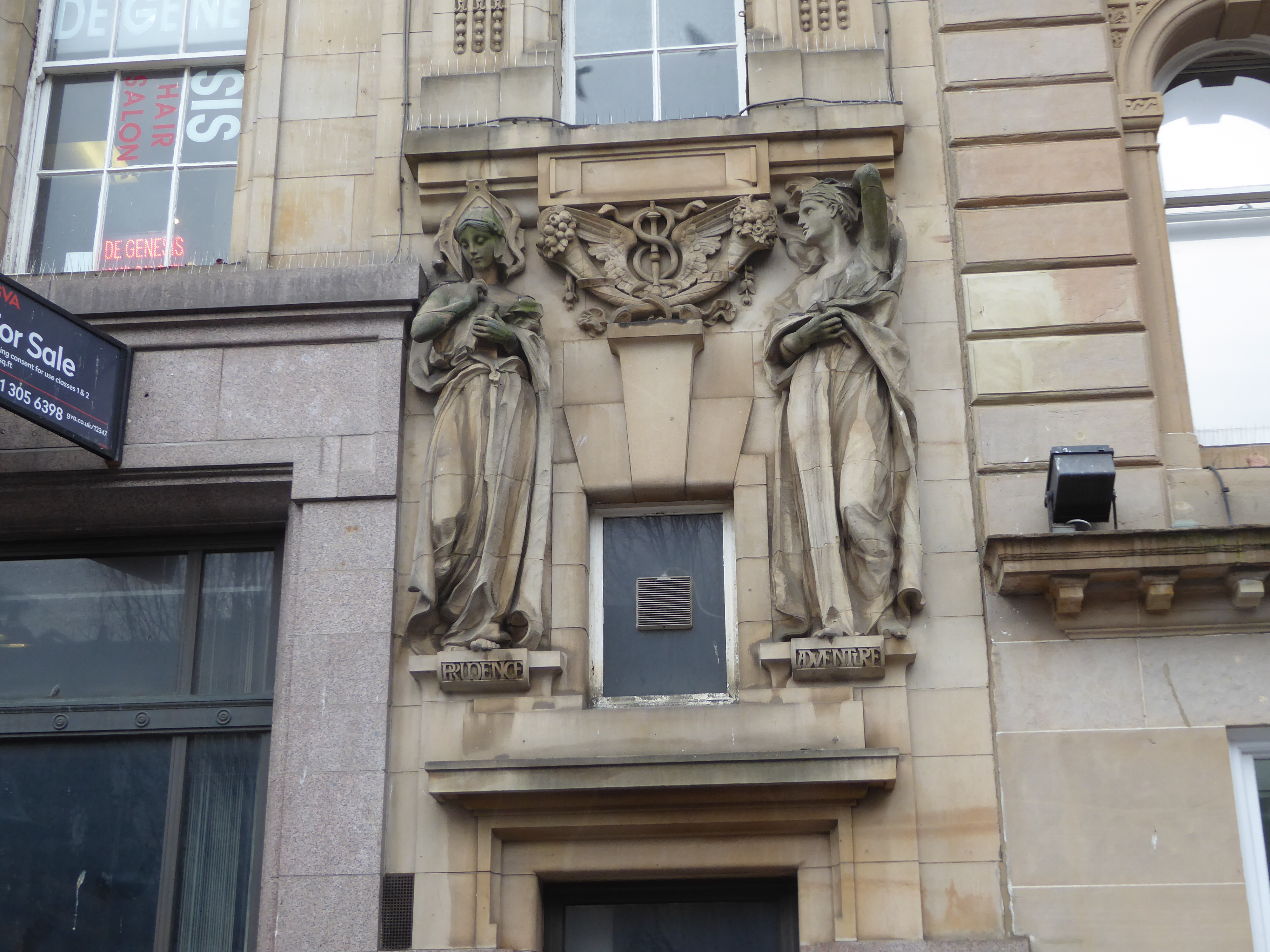 Four figures were designed by Phyllis Archibald for the building. Yes, a female sculptor. These two are labelled Prudence and Adventure, and