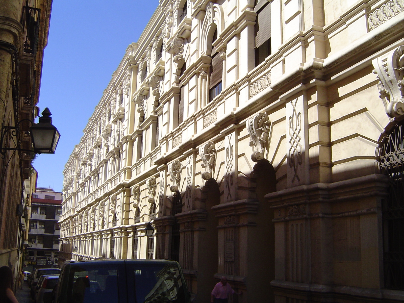 Nearby, the massive bulk of a high school.