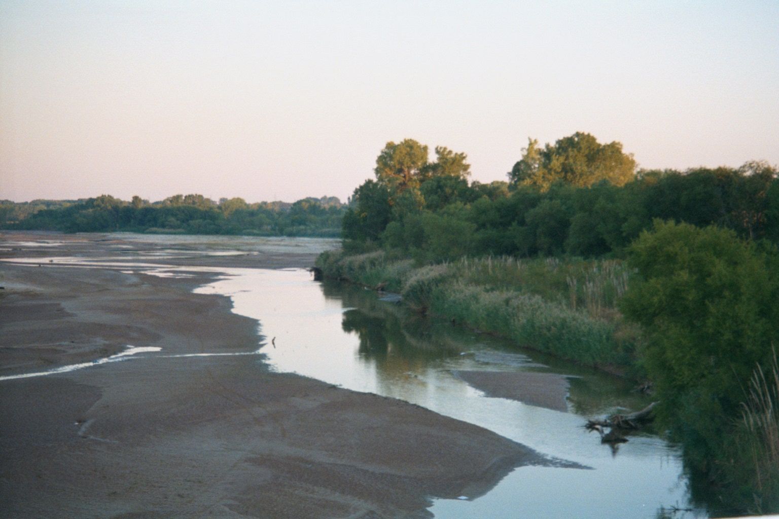 In summer, the water is very warm. Twenty miles downstream from this spot, white homesteaders in 1889 came splashing across the river to sta