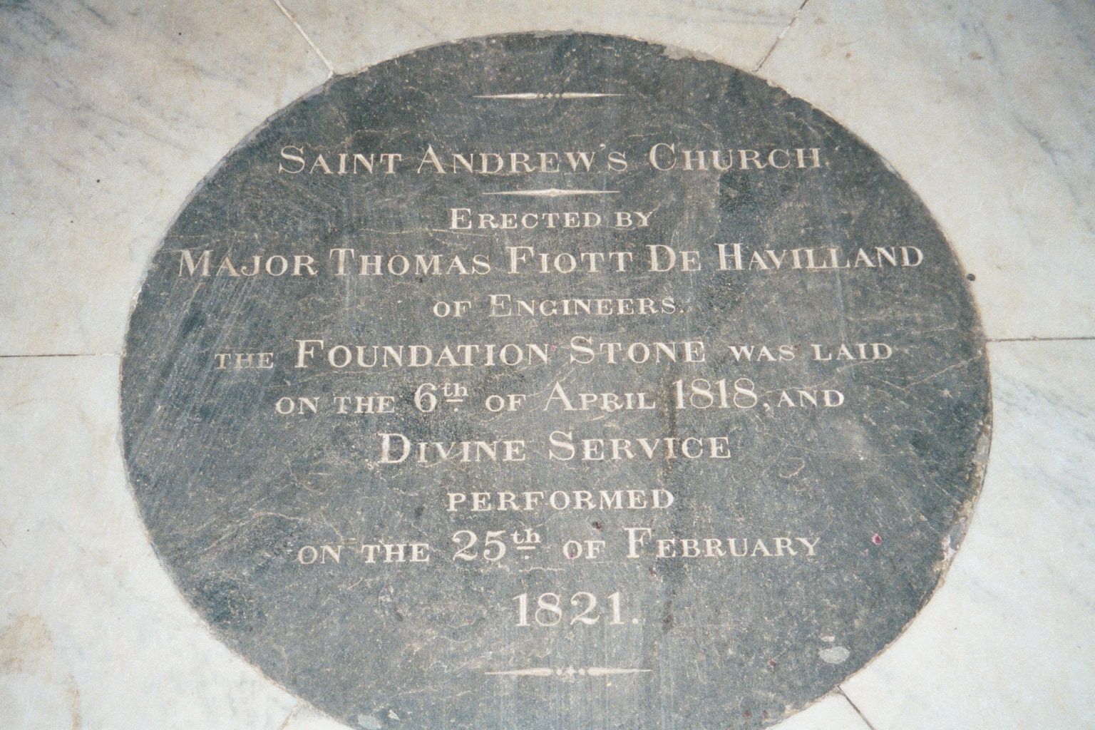 On the floor of the church. De Havilland retired to Guernsey in 1825 and lived until 1866, when he expired, aged 90.