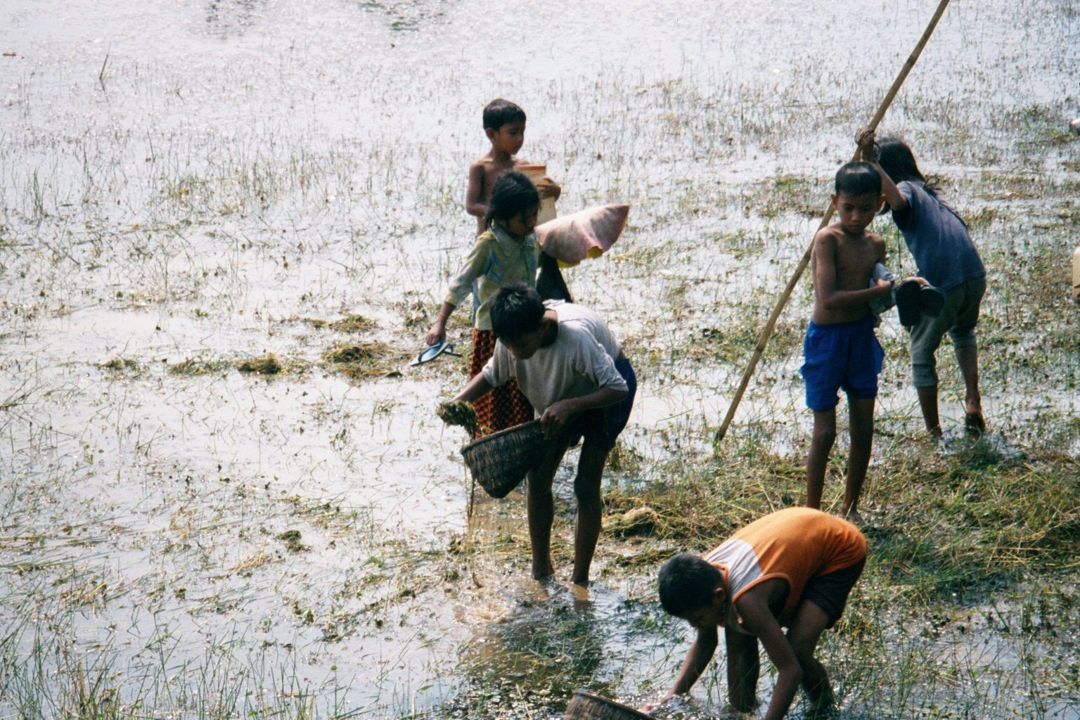 Fishing in the Srah Srang, a rectangular pool east of Ta Prohm.