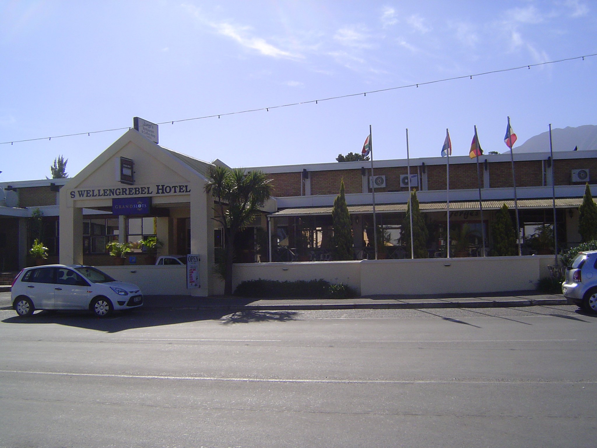This was the Commercial Hotel in 1924. Since it can't play the gables-and-thatch card, it adopts at least an Afrikaner name.