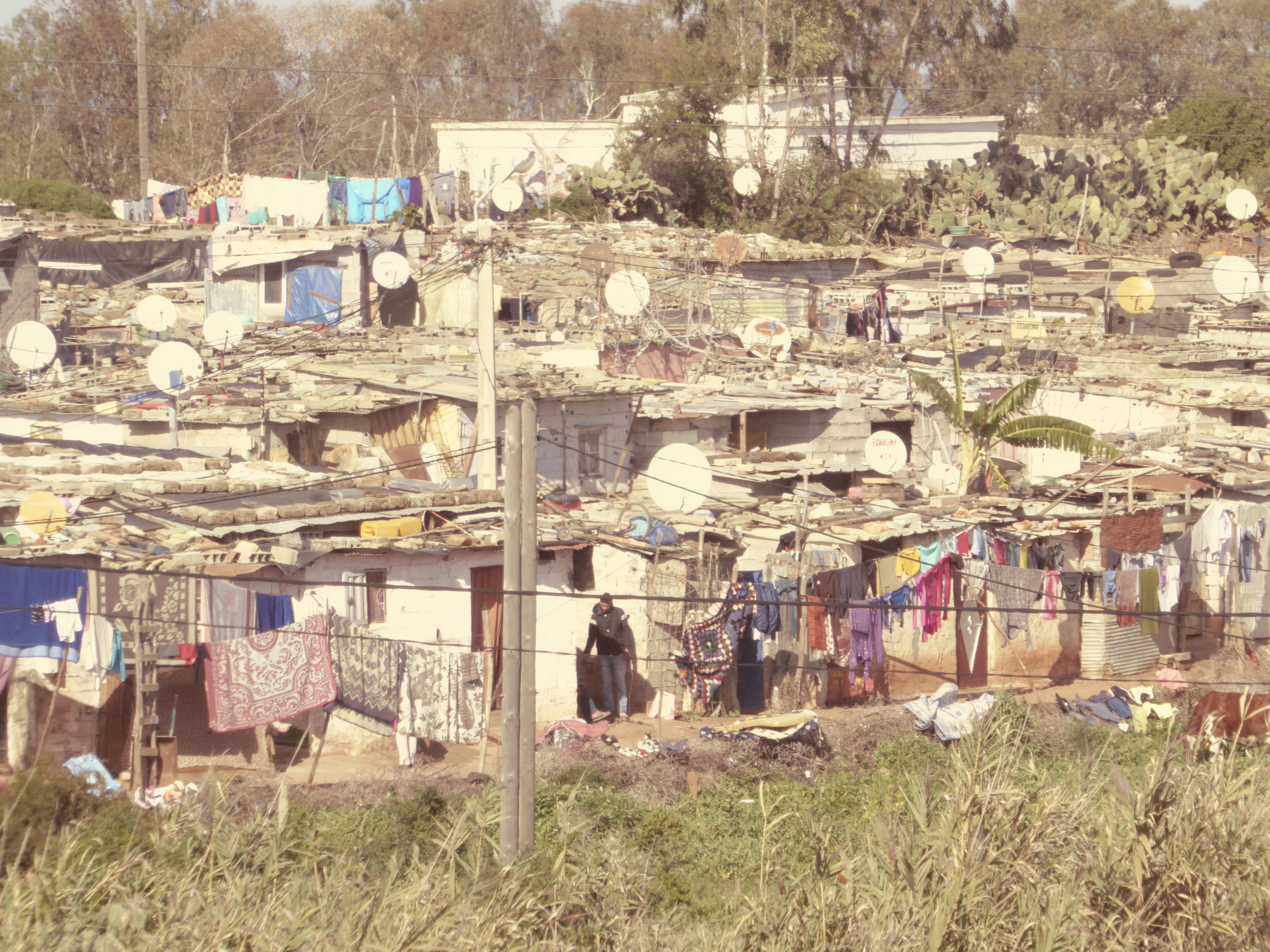 What catches your eye? Yes, it's the satellite dishes. Think the king is delighted that even slum-dwellers in his country have access to the
