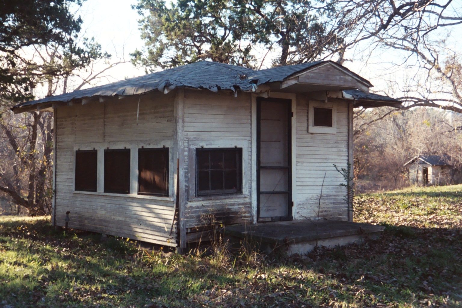 Last rented in the 1950s? The Paluxy is just behind the cabin, where the ground slopes away.