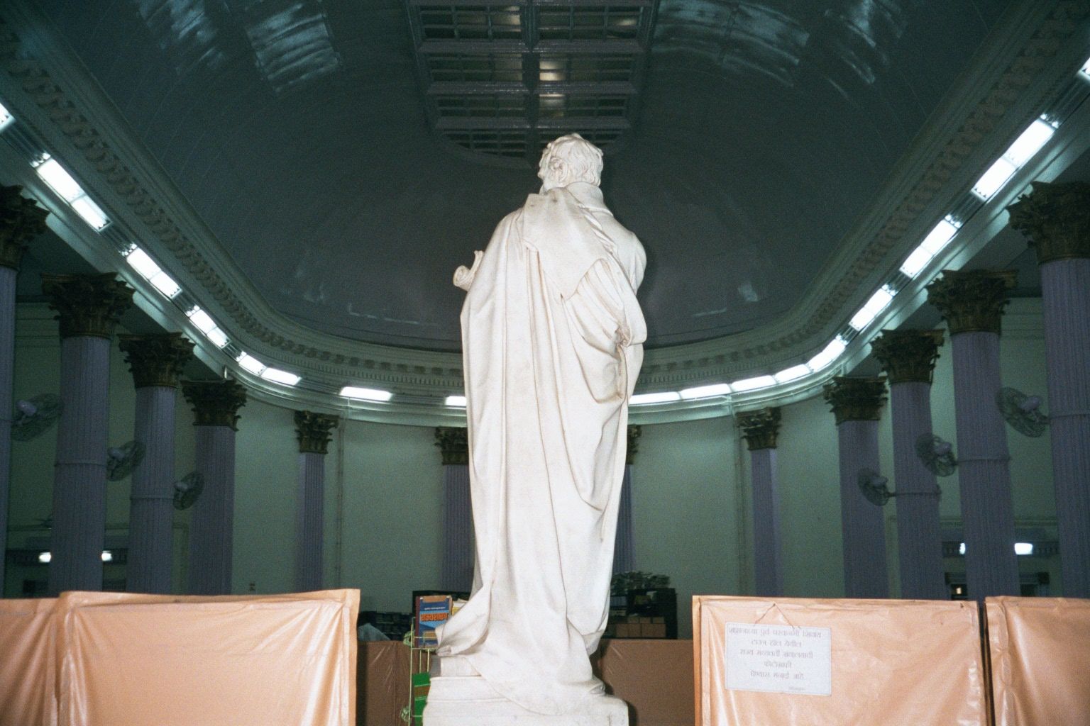 Proconsul in toga, bathed in fluorescent light. This happens to be Mountstuart Elphinstone, by Chantrey, in the reading room of the old Town