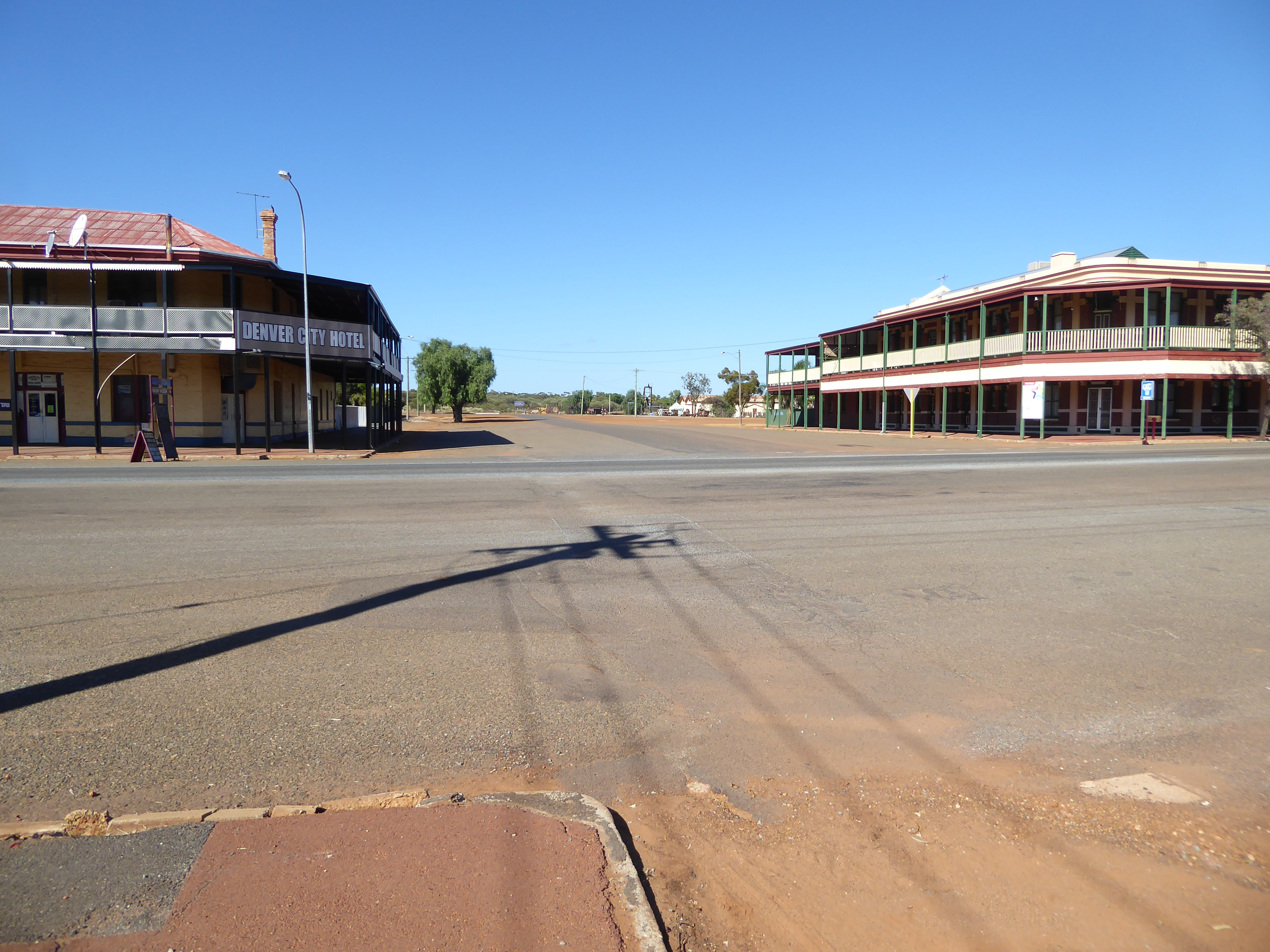 Here's the main intersection in town: straight ahead and off to the right a bit, there's an abandoned railway station. Hard to imagine 15,00