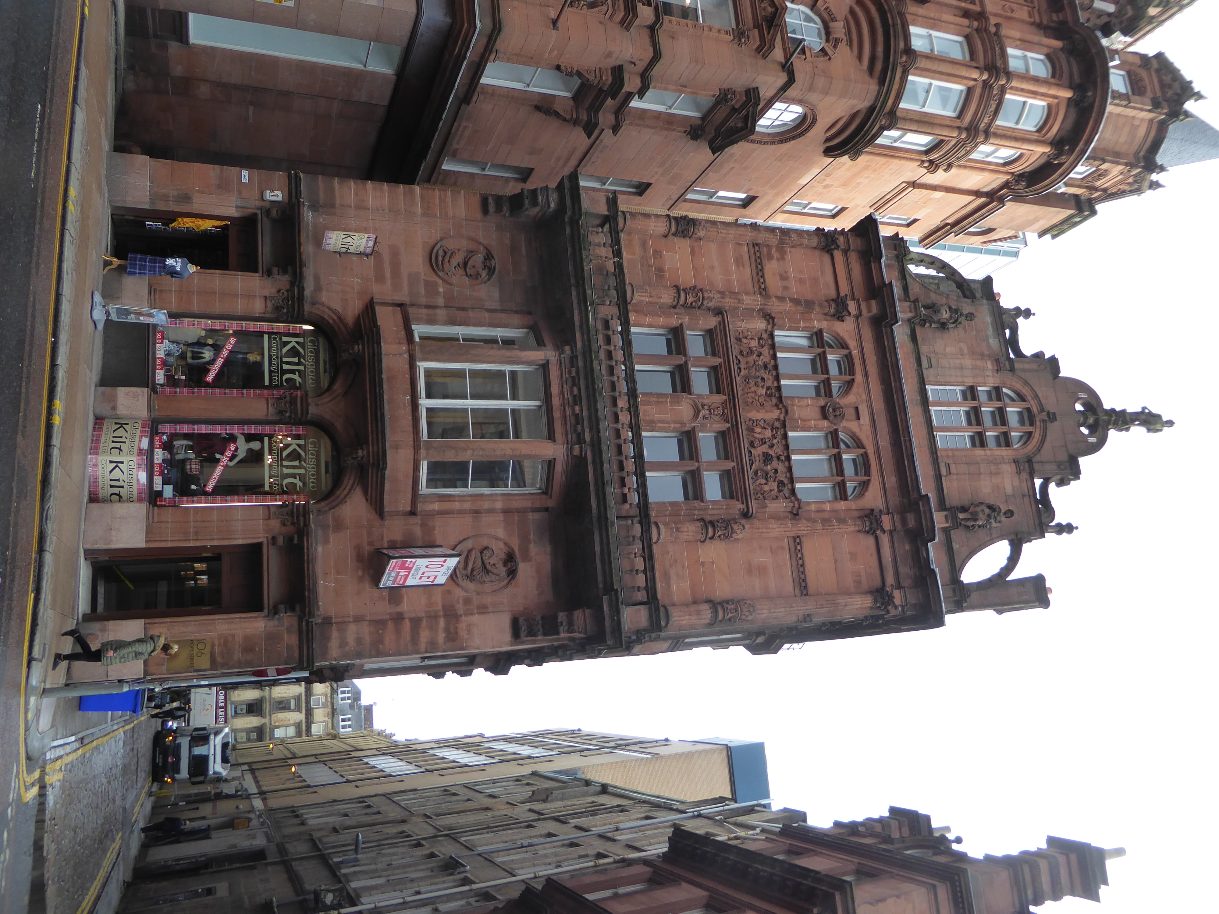 Built for the Scottish Temperance League, the building was converted in 1919 to house The Daily Record. Williamson calls it Franco-Flemish,