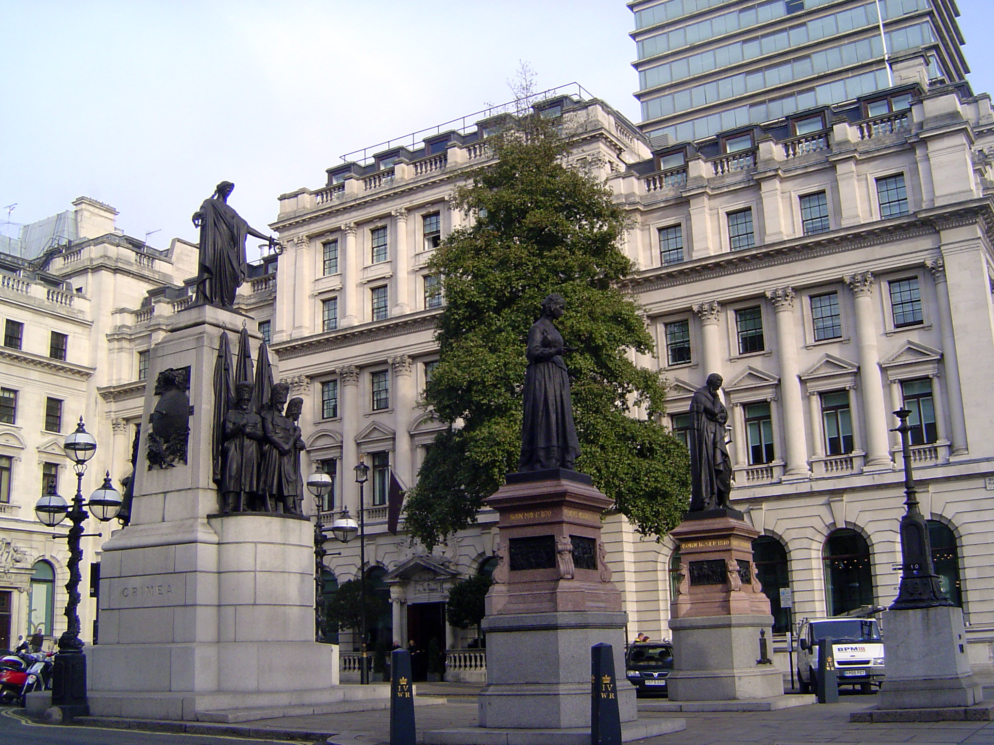 The statue in the foreground is Florence Nightingale, first prominent for her work during the Crimean War, memorialized behind her. To her l
