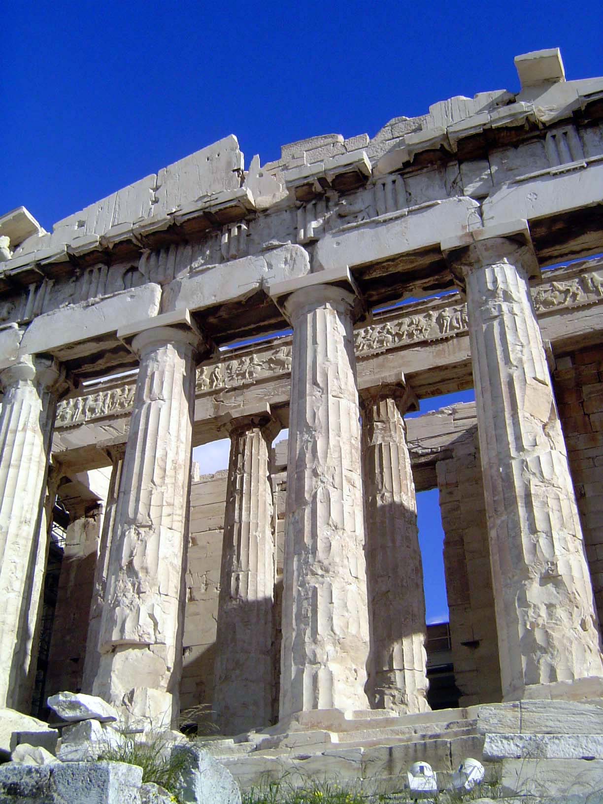 In the shade atop the architrave you can make out the vertically striped triglyphs and the intervening metopes, which were sculpted, though