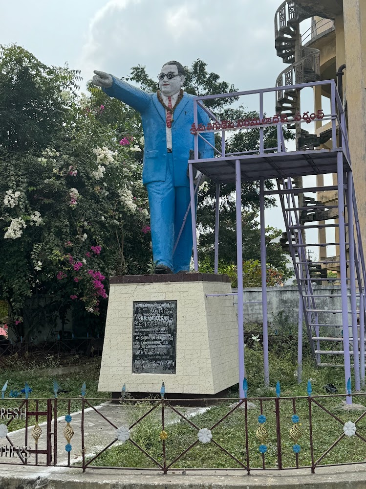 He's Dr. Ambedkar, shown about 20 miles upstream and here very close to the Amaravati stupa.  It could be a deliberate juxtaposition, given