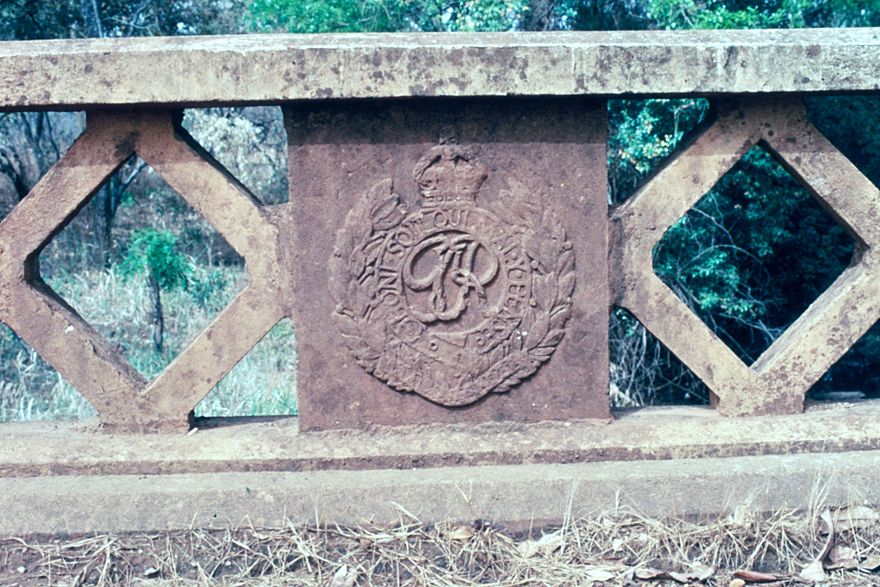 George Rex, with crown and laurels, cast in the bridge railings. The same insignia can be found in lots of other countries around the world,