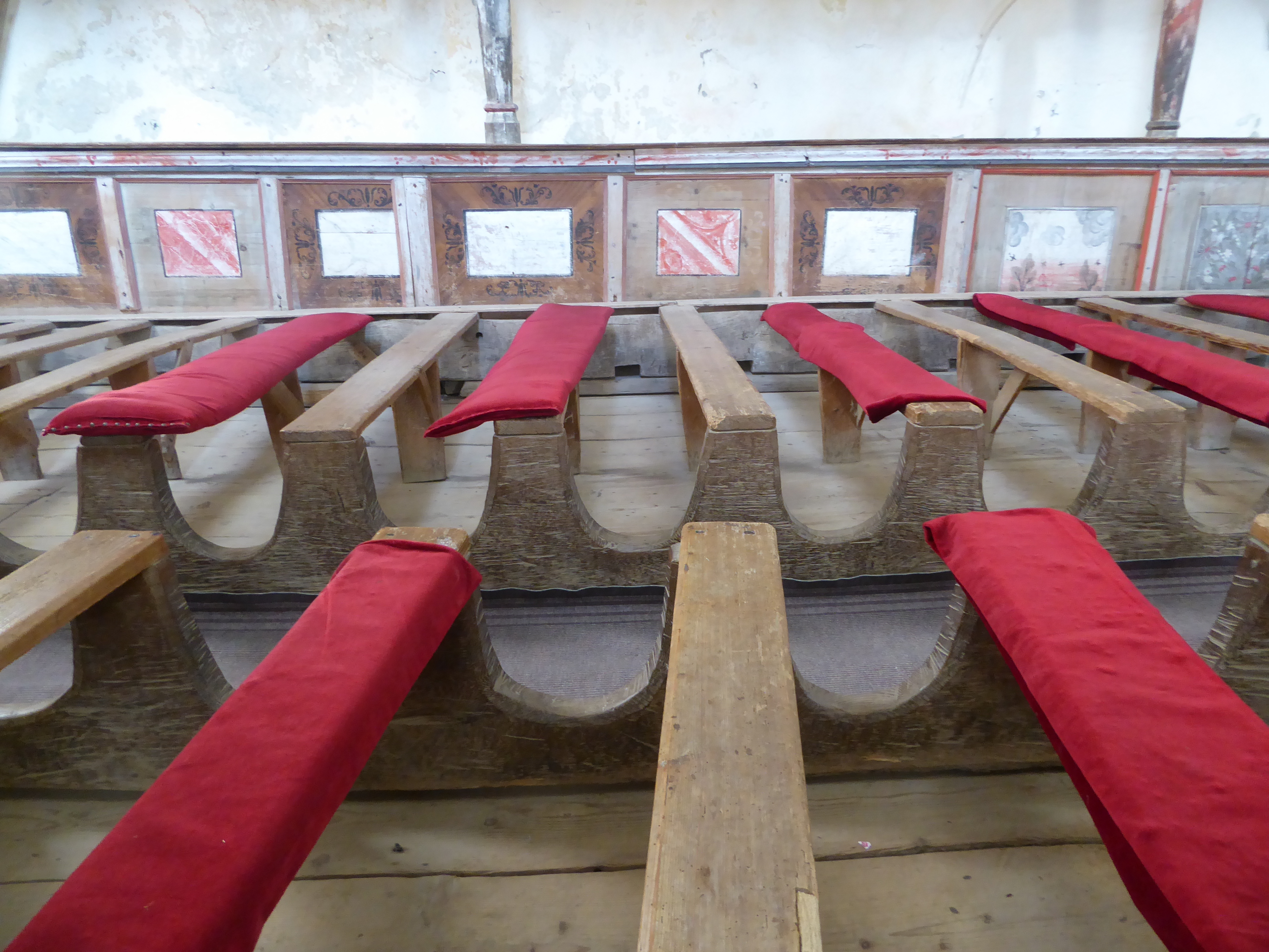 The pews are cleverly built to foil anyone trying to move them around.