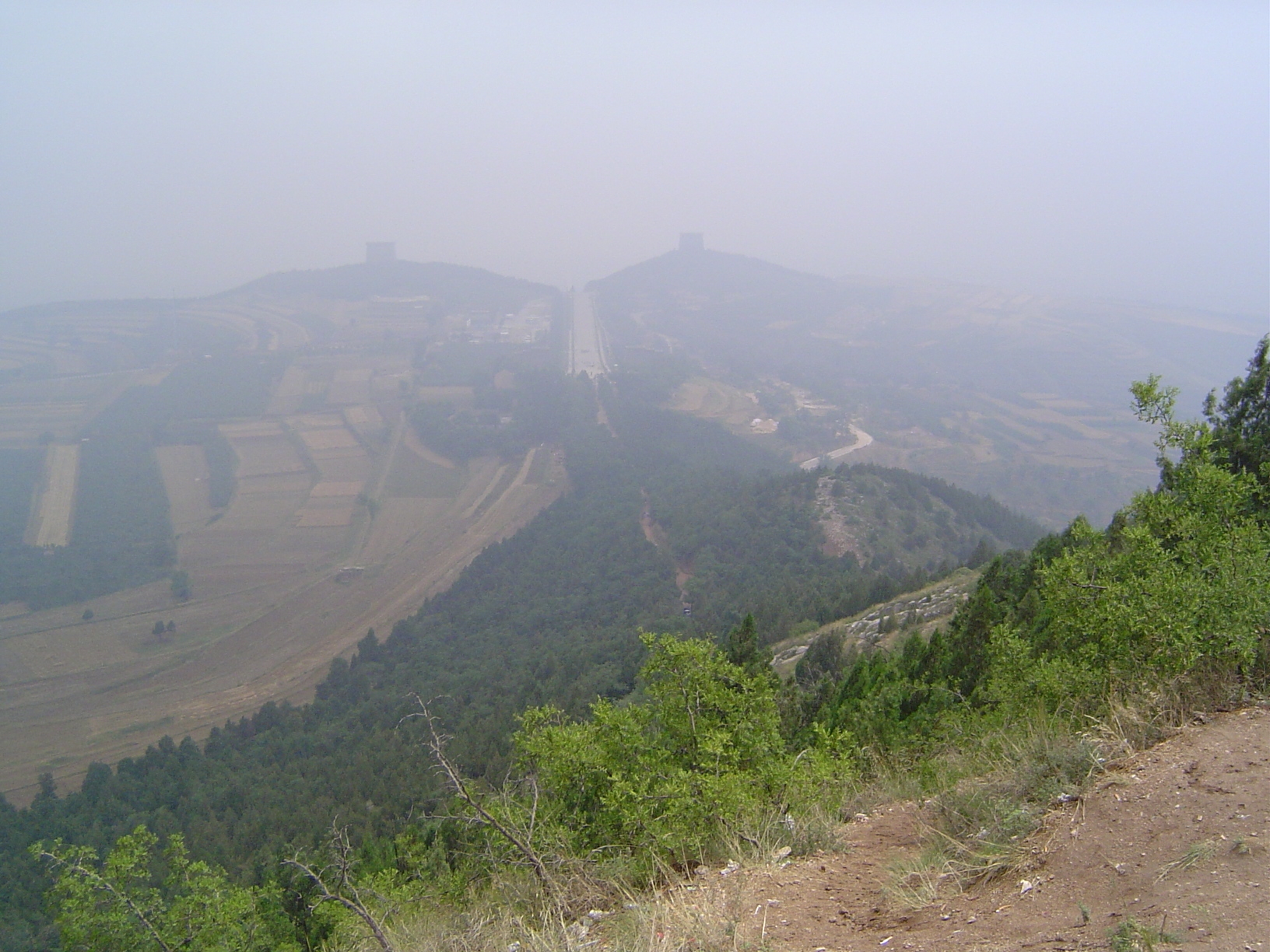 We've climbed up on Mt. Liang to view Qianling. It's the burial place of the Emperor Gaozong d. 684 and of China's only ruling empress, the