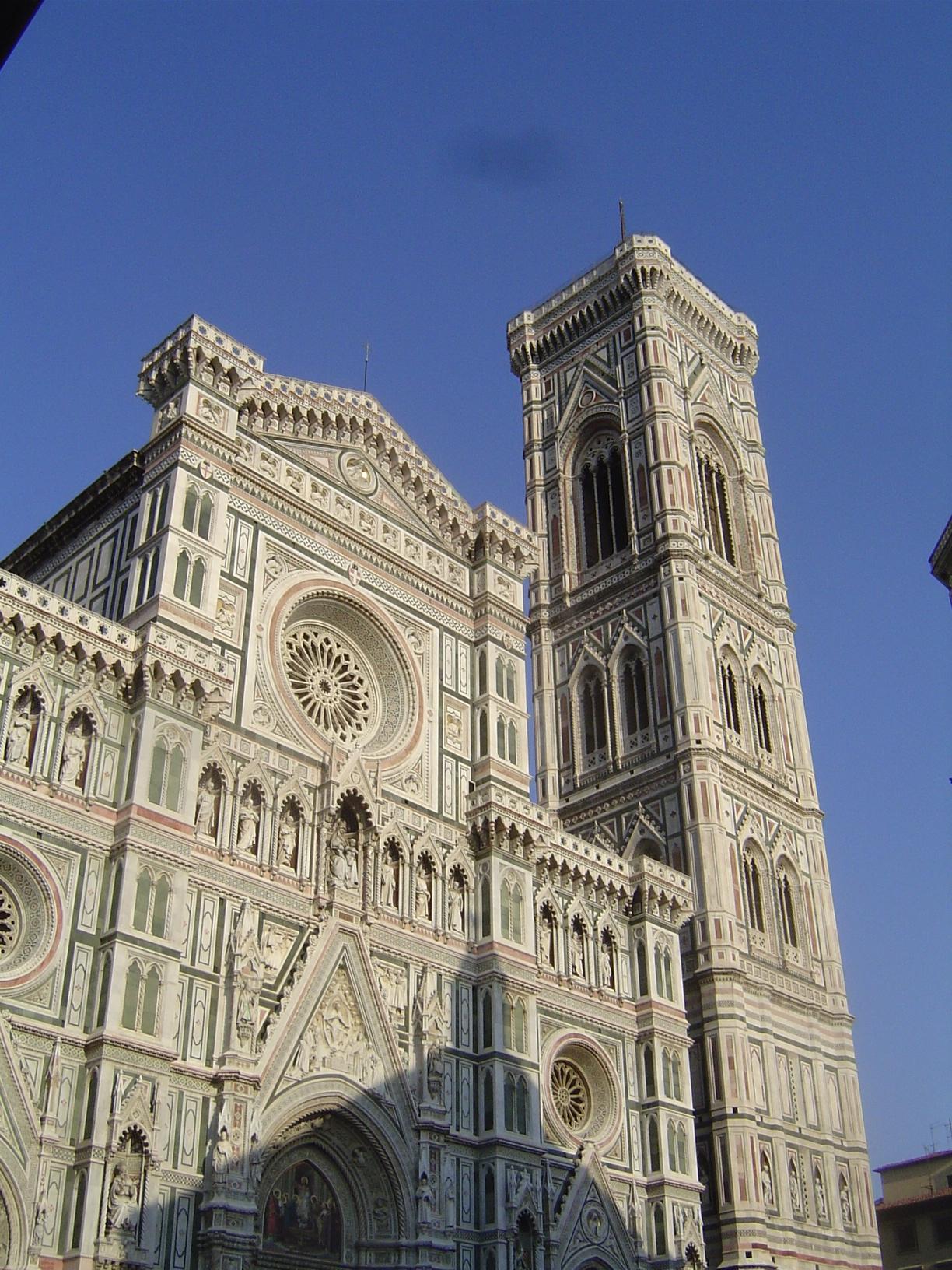 This is Santa Maria del Fiore, Florence's cathedral. It was begun in 1296 and has a Latin-cross design laid out by Arnolfo de Cambio. The do