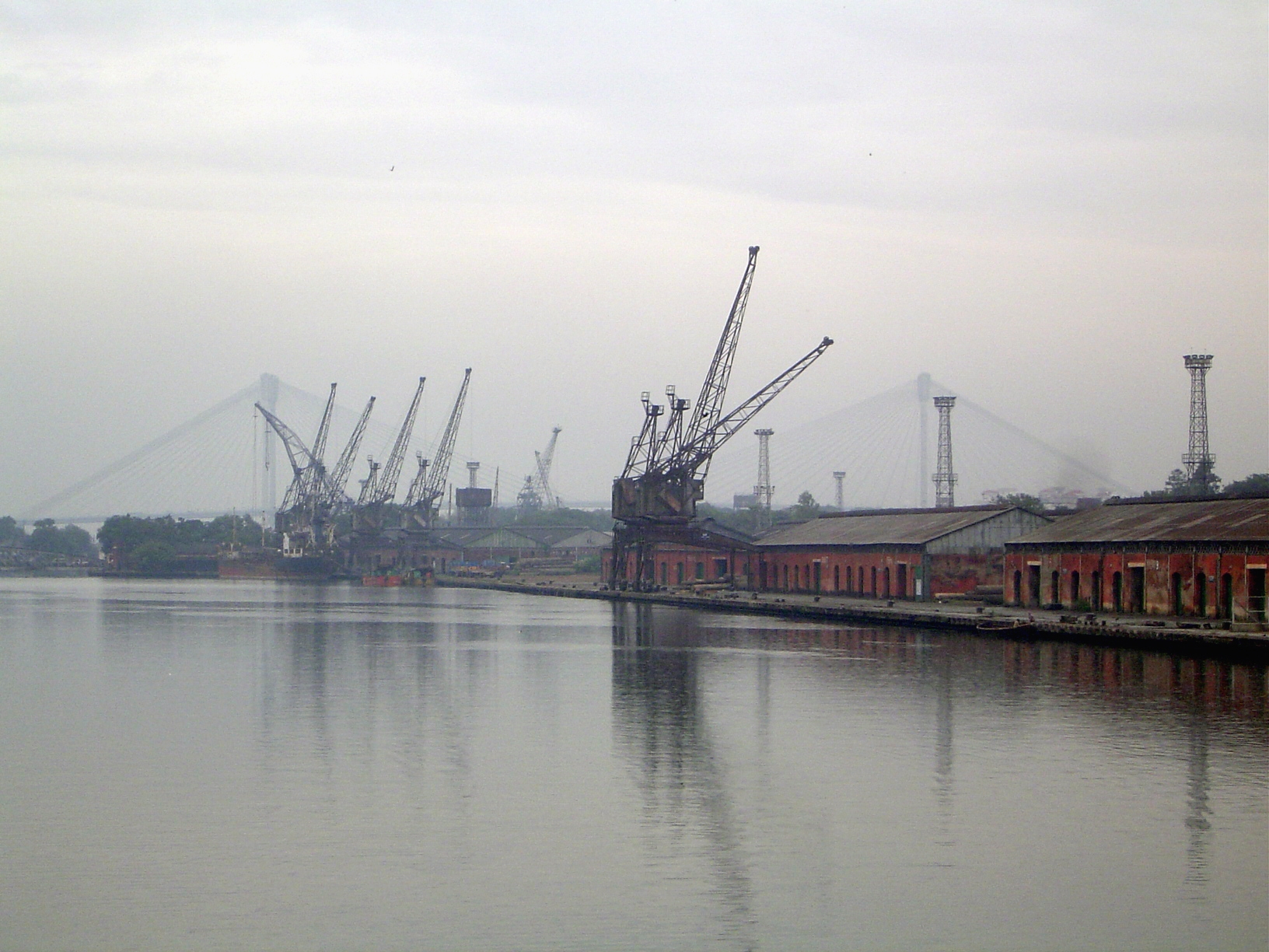 In the distance, the two towers and suspension cables of the second Hooghly Bridge.