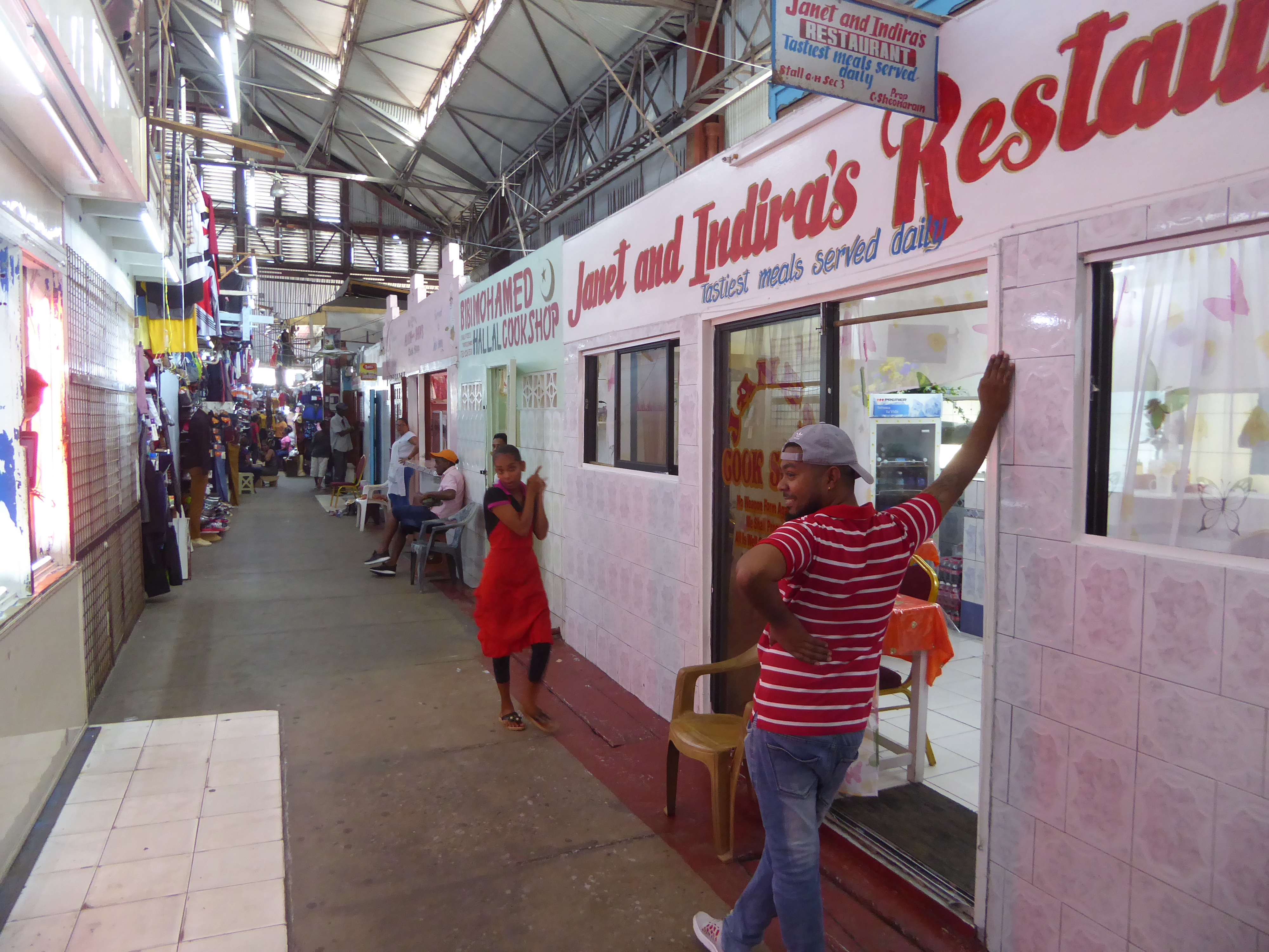 Small sit-down restaurants line one wall.