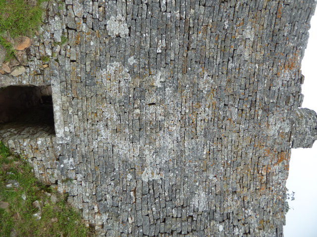 The doorway is of historically accurate dimensions but judging from the granite lintel is a reconstruction.