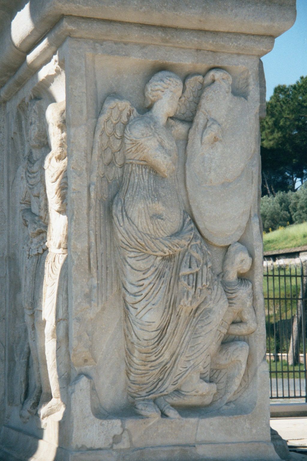 Contrast them with this crude statue of Victory, sculpted for the occasion and placed close to the ground.
