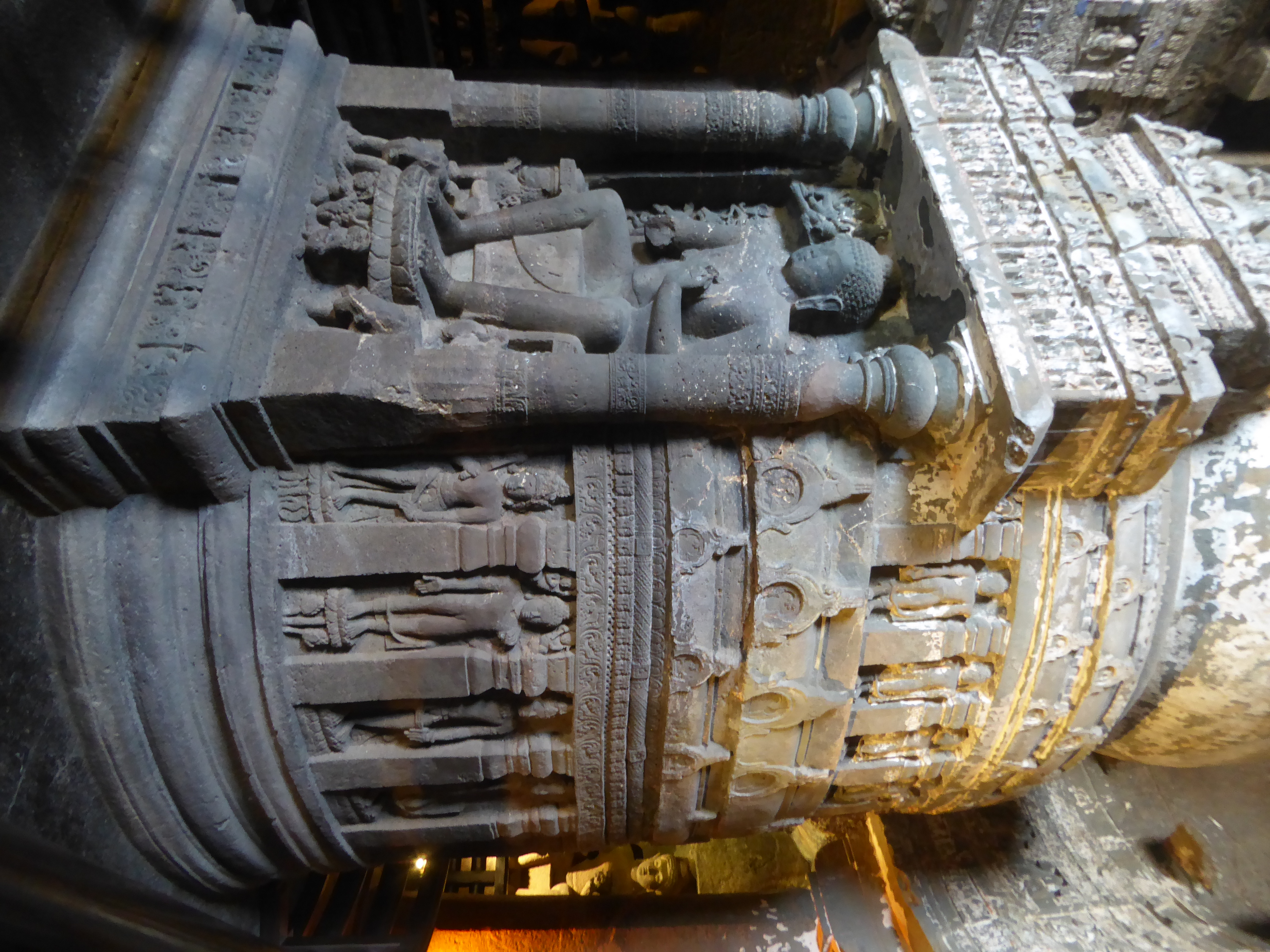 Spink suggests that the sculptors originally intended a standing Buddha, but when he sat down they ran out of space and had to move the atte