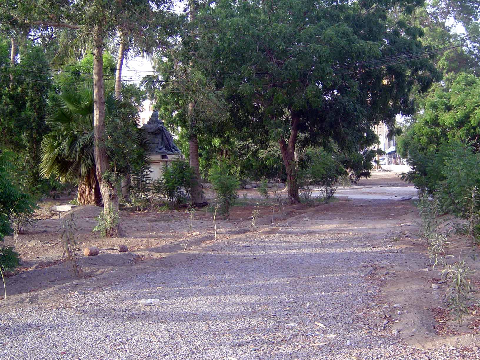 It needed a park, too. Can you make out that object in the trees on the left? It's a dark mass atop a light-colored base.