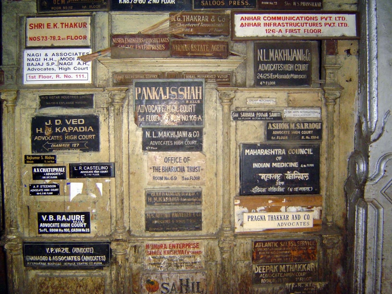 Signboards for the building's present tenants.