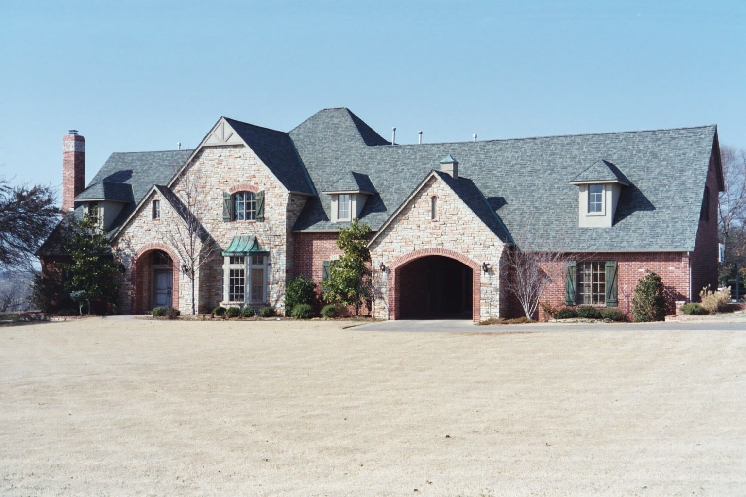 This is what you can get for a million dollars: a rancher-cum-castle, with a tunnel leading into the keep—oops, garage.