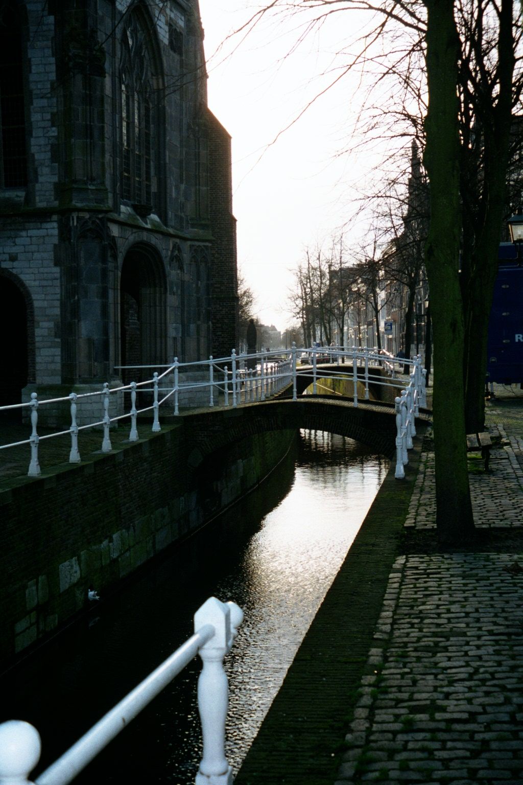 The Oude Delft canal curves deviously around that Old Church.