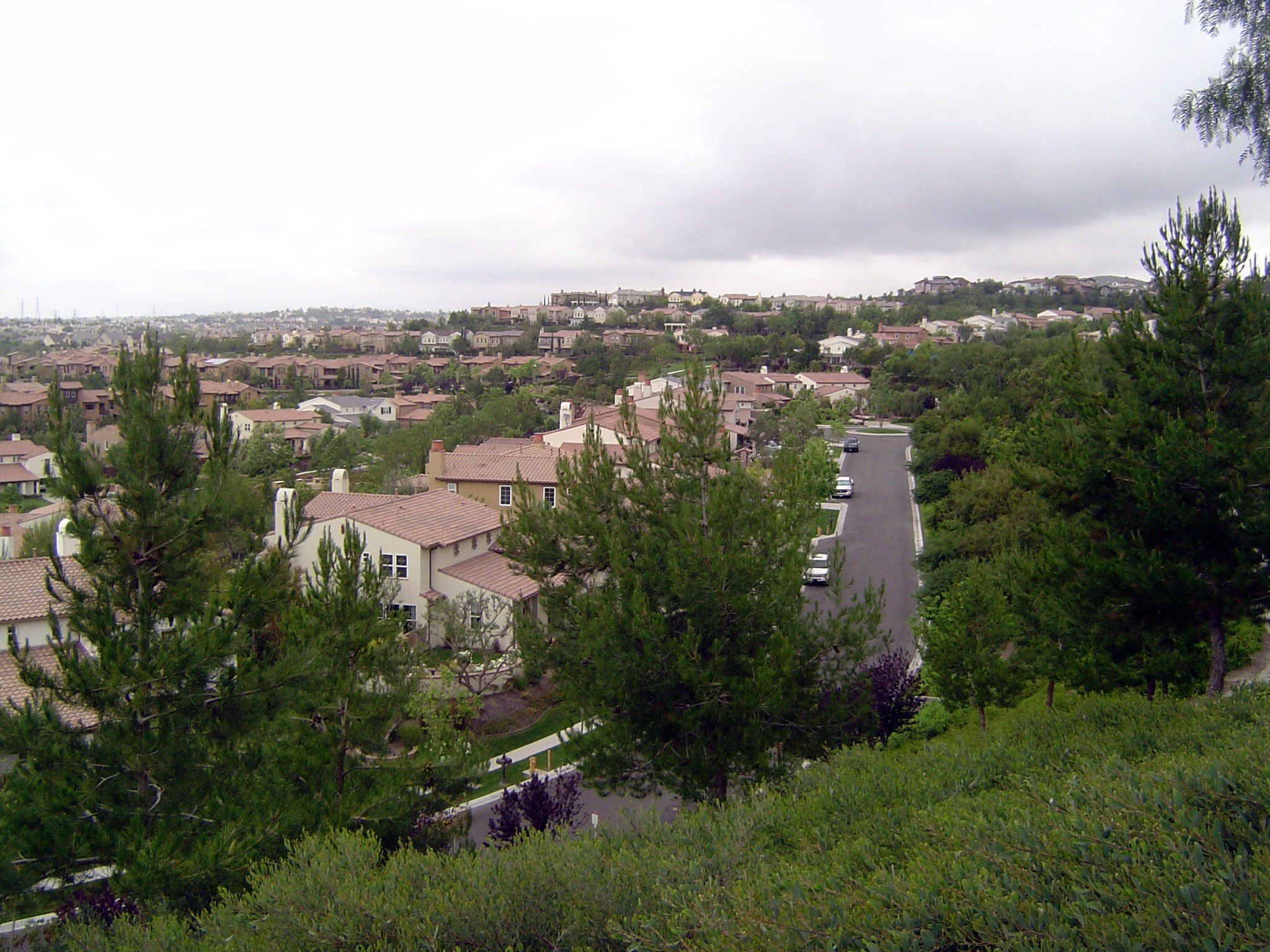 Housing, for starters. We've come to Ladera Ranch, 50 miles southeast of LAX. Several thousand houses have been plopped into the green and g