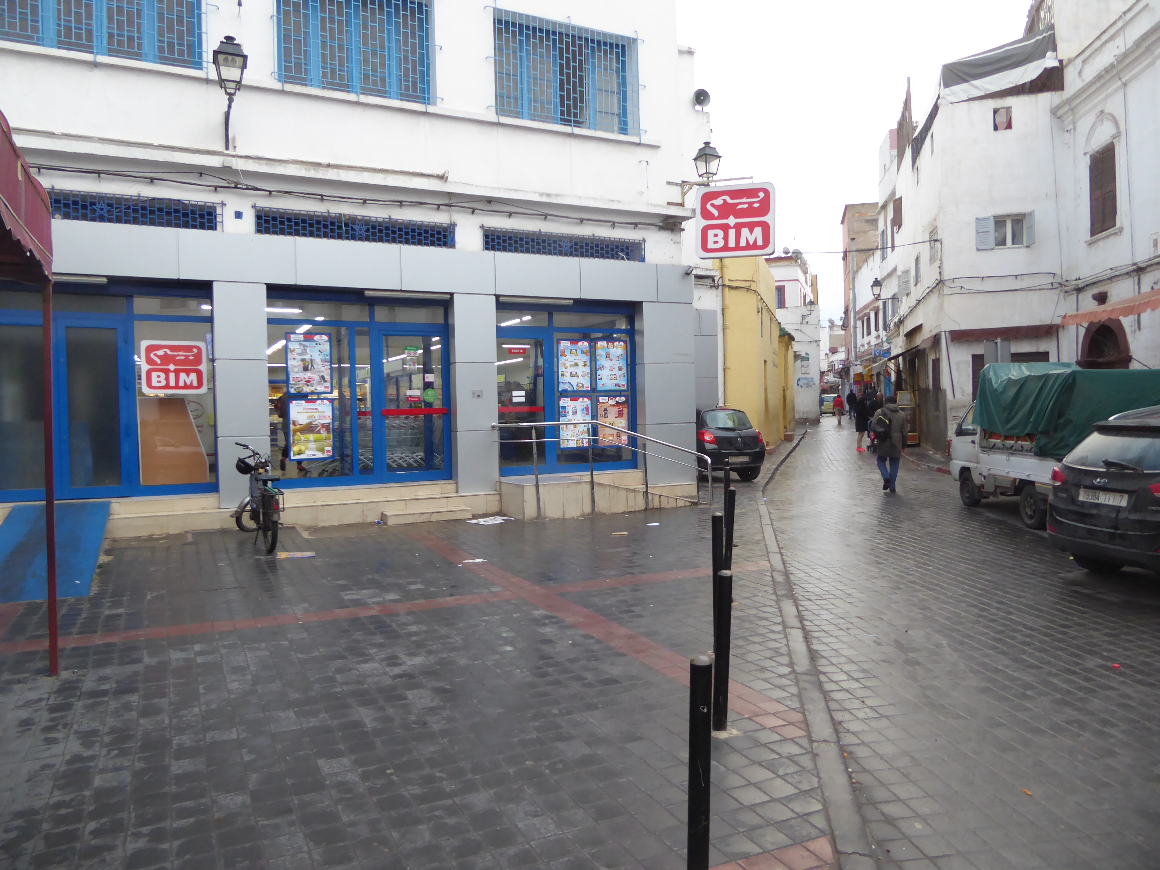 It also has new ones, like this supermarket. The paving is suspiciously perfect, a reminder that as early as 1909 the French began installin