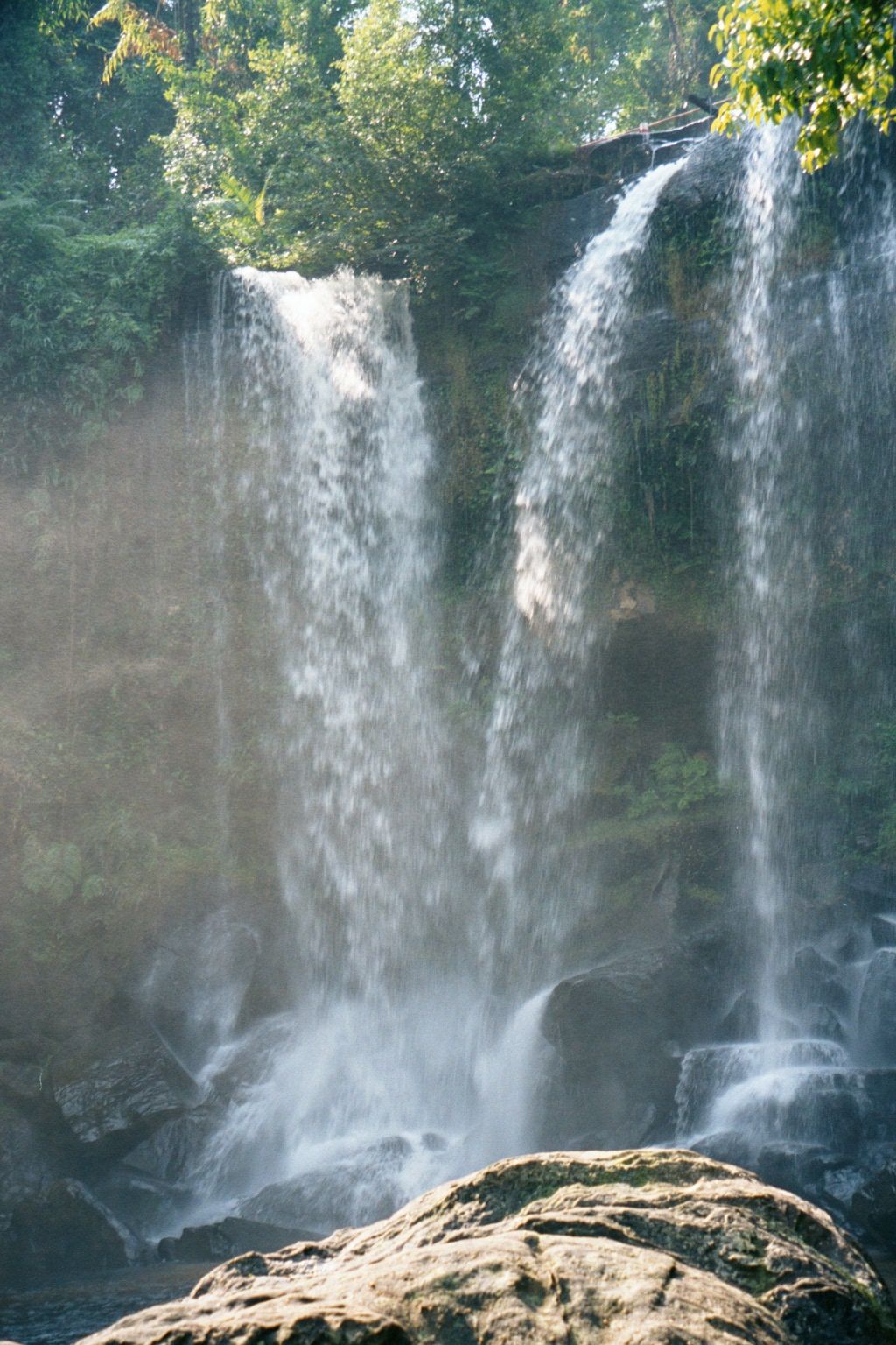 Change of gears: we've moved over to the east branch and, high up on the Phnom Kulen, a very impressive waterfall. Yes, swimming is possible