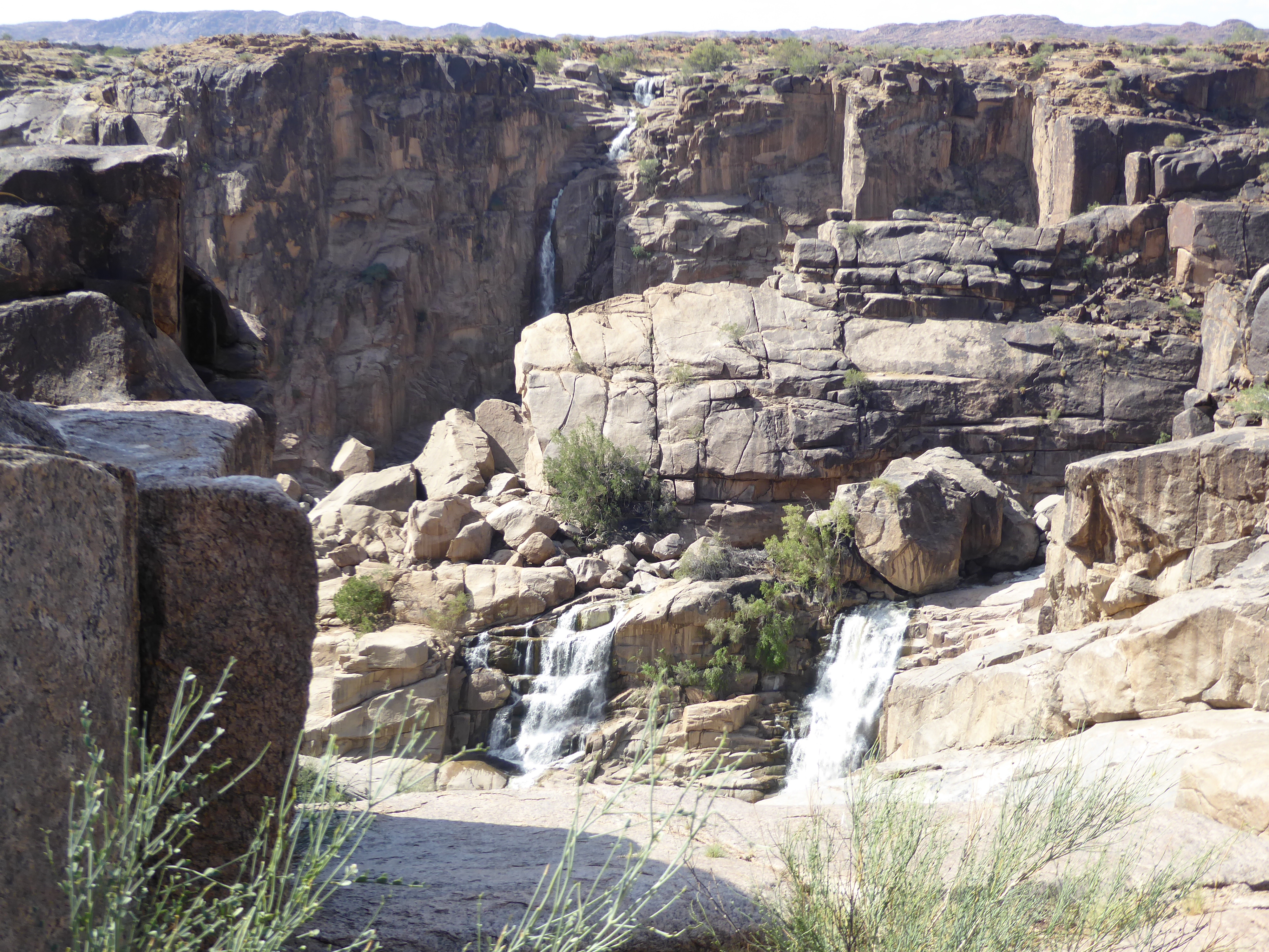 I'd rather sit in some shade downstream from the falls, but only after checking for puff adders. The waterfall is a bit undisciplined, and y
