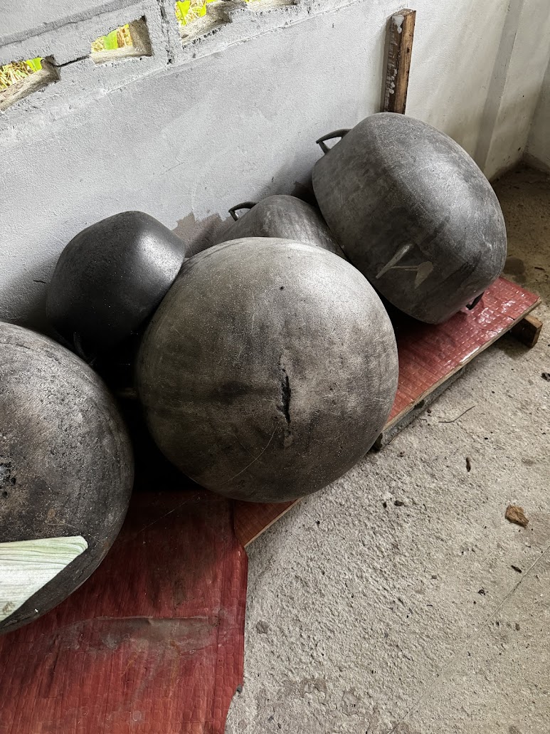 Kitchen pots at the rear of the temple.