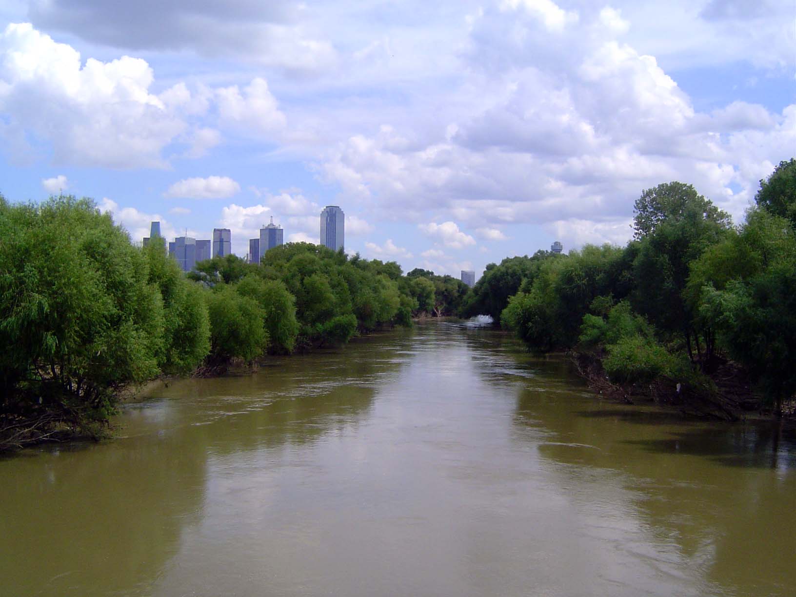 Meanwhile, the Trinity flows along. A hotly debated plan has the city building a new bypass highway at the edge of the floodplain. I-35 is t
