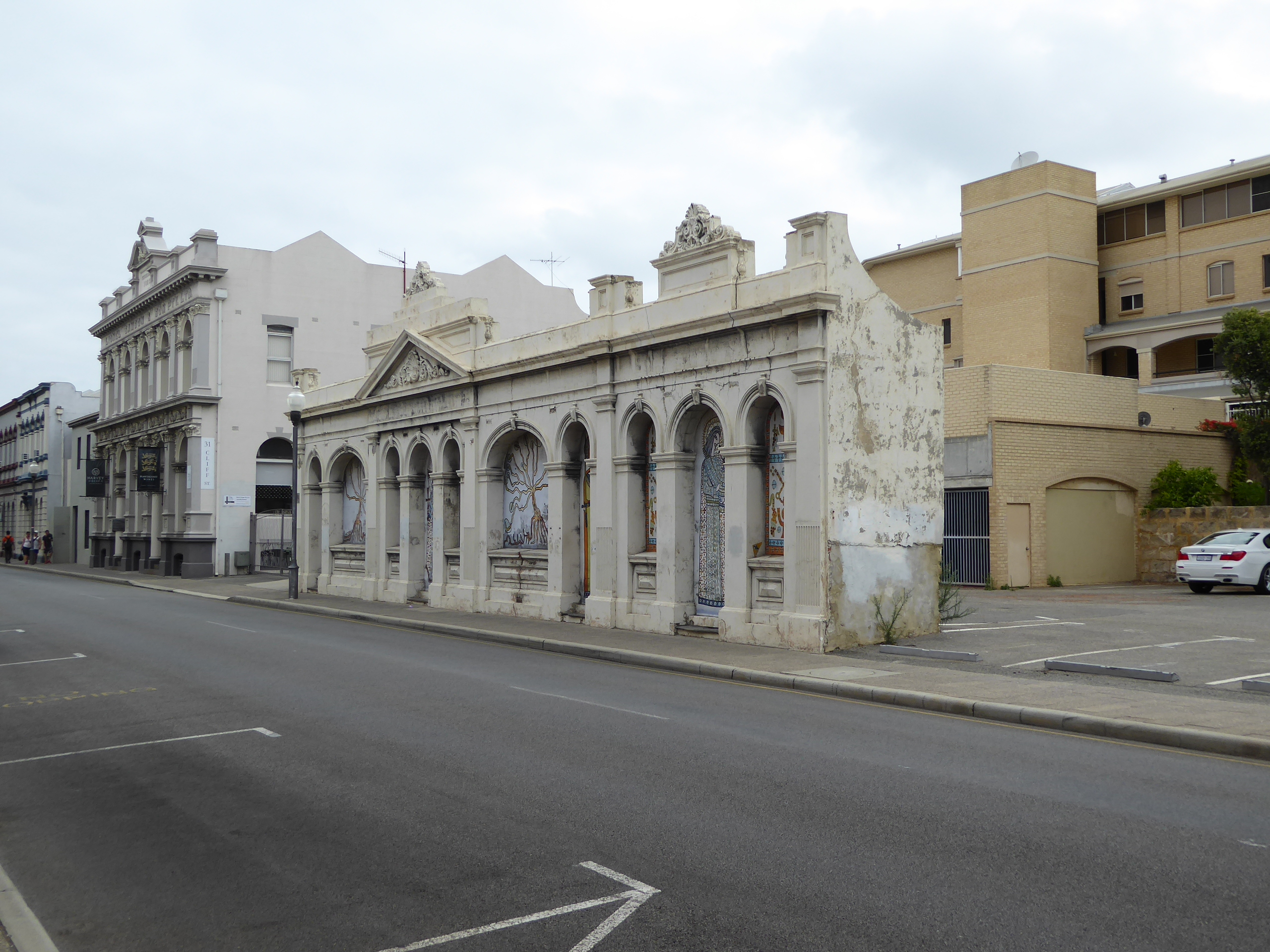 Well, here's another, just down the street to the right. The demolition crew went to work in 1967 but quit for some reason, and in 1974 the