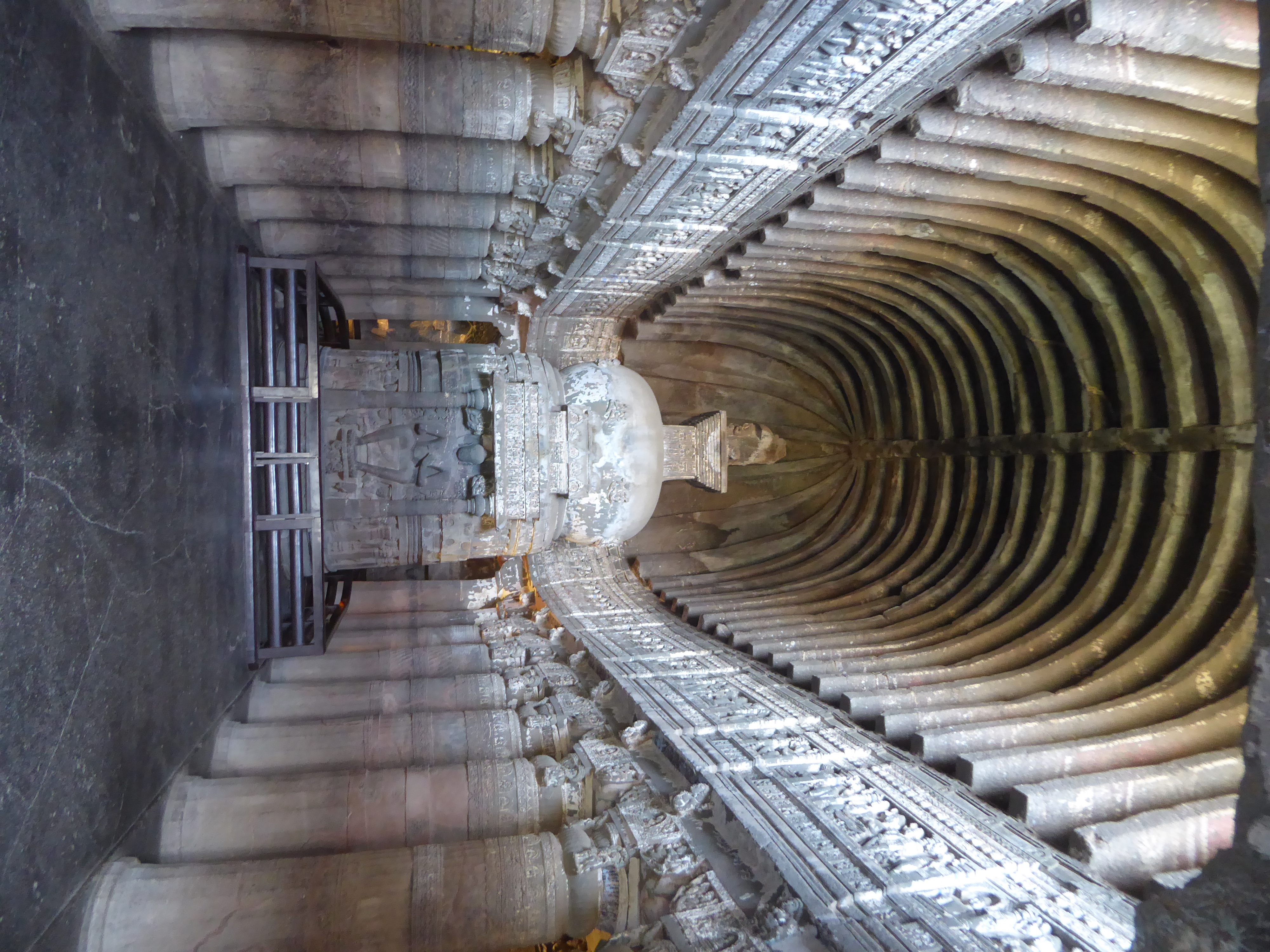 Here's Cave 26, with the Buddha again integral to the stupa but shown, in the style of the slightly later day, sitting on a throne. The para