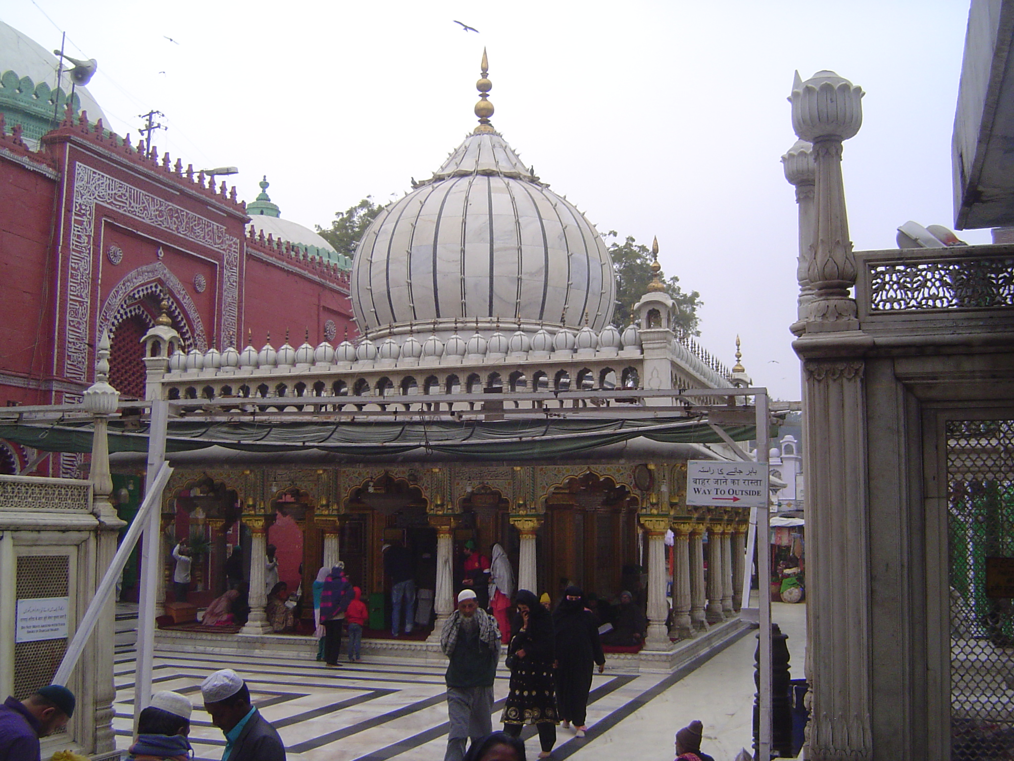 This is the dargah or shrine of Nizamuddin Auliya, which is to say Saint Nizamuddin, who died in 1324. His status was appraised almost 150 y