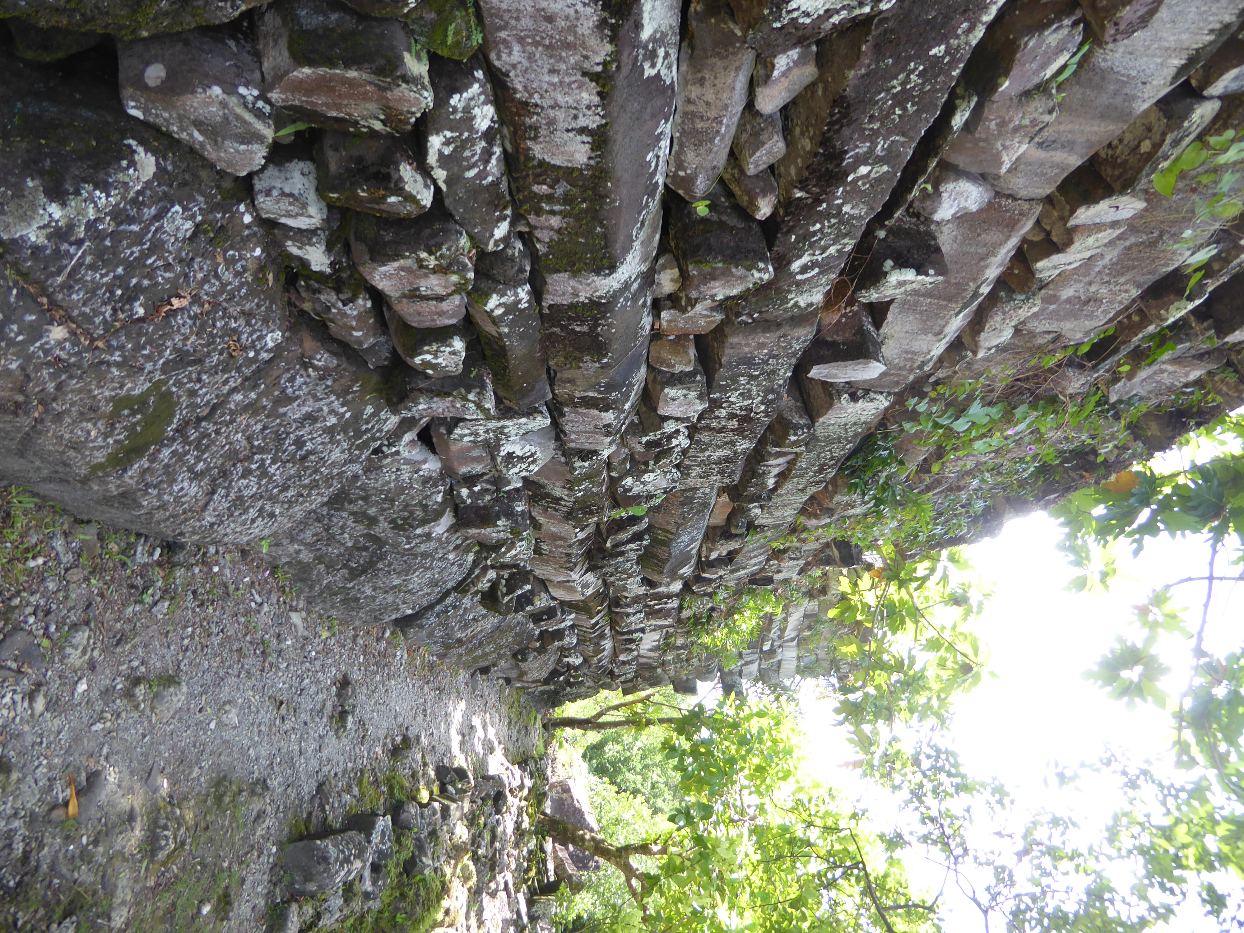 We've scooted through it and are on our way around the outside of the enclosure. I'm looking at those base rocks and still wondering how the
