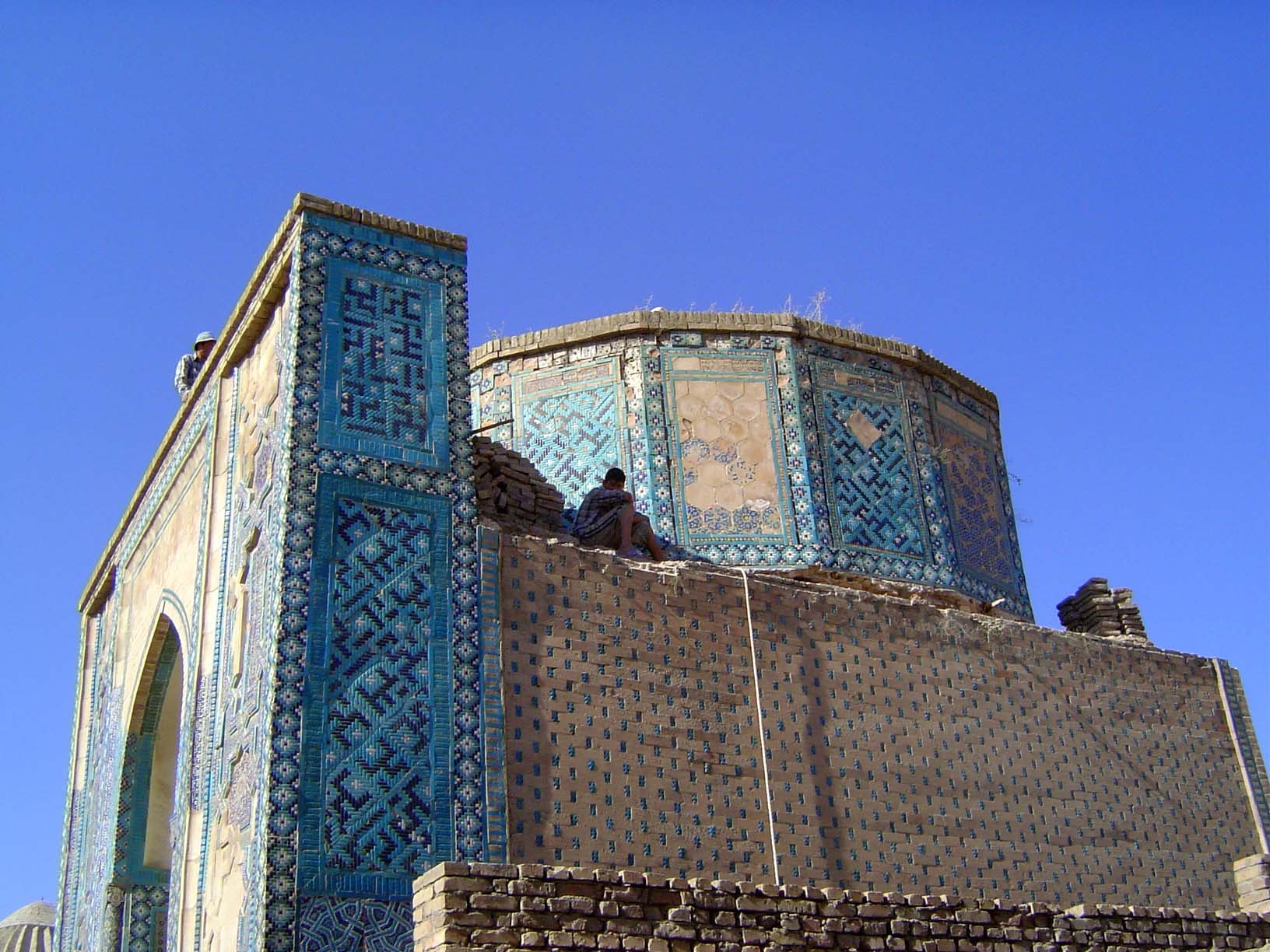 Leaving the upper group and walking down the alley to the tomb known by the architect's name: Ostad "Master" Ali Nasafi 1380. The external d