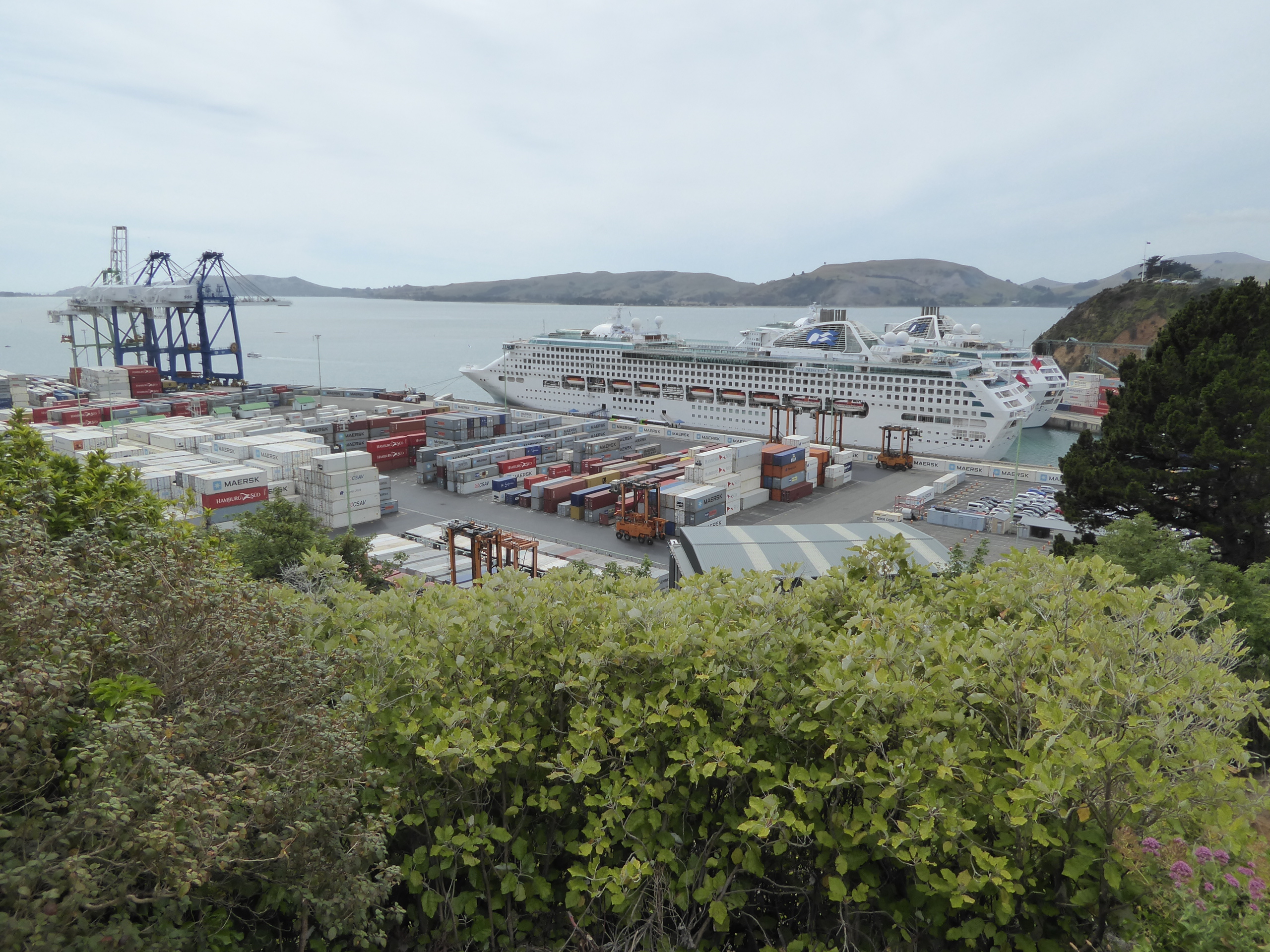 The filled land is now a container port. The cruise ships may be a surprise, but the Queen Elizabeth 2 docked here in 1992, and fleets of bu