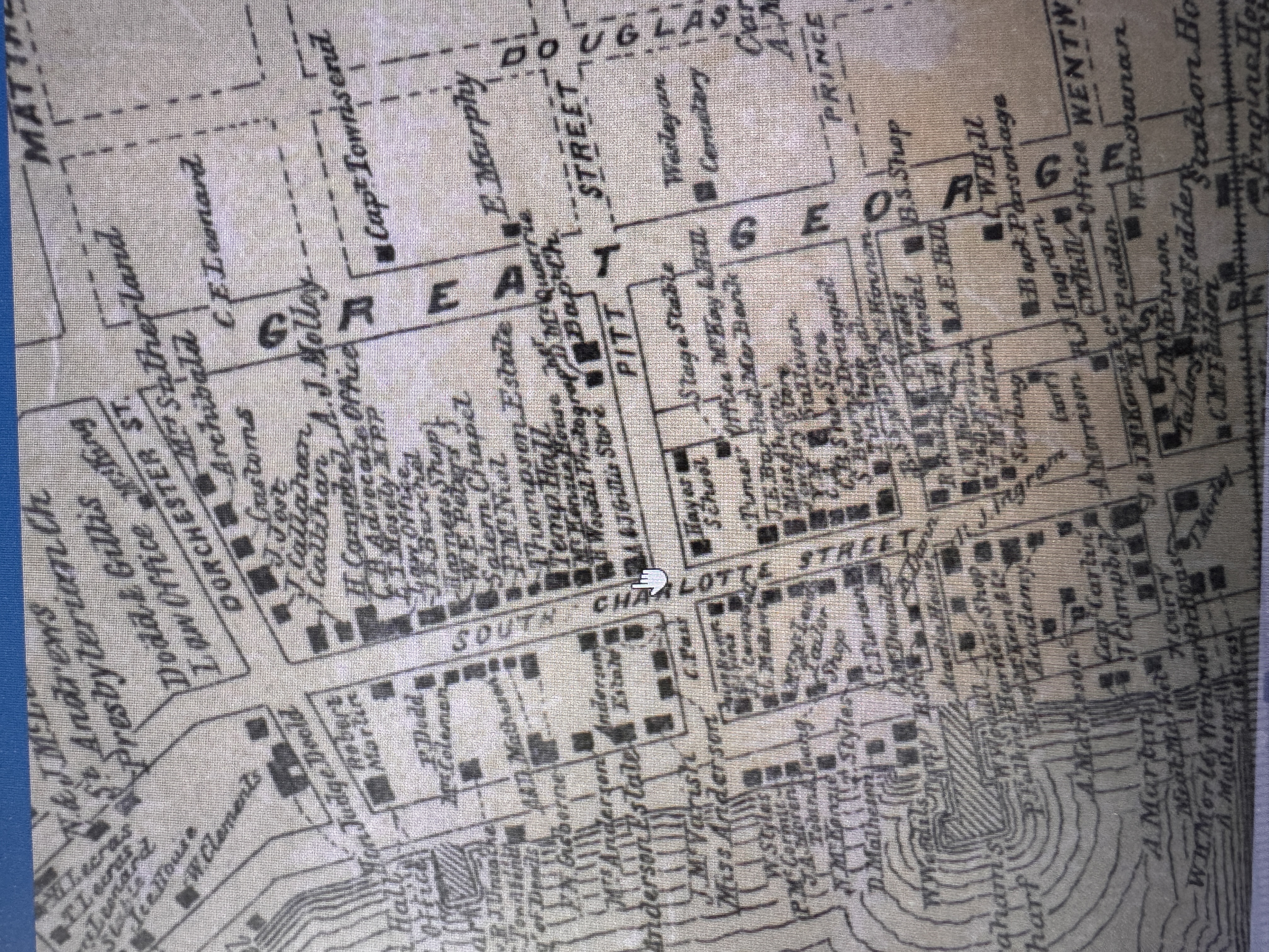 Fast forward to 1877. There's been a lot of development, though few, if any, of the buildings or businesses shown here survive.

https://arc
